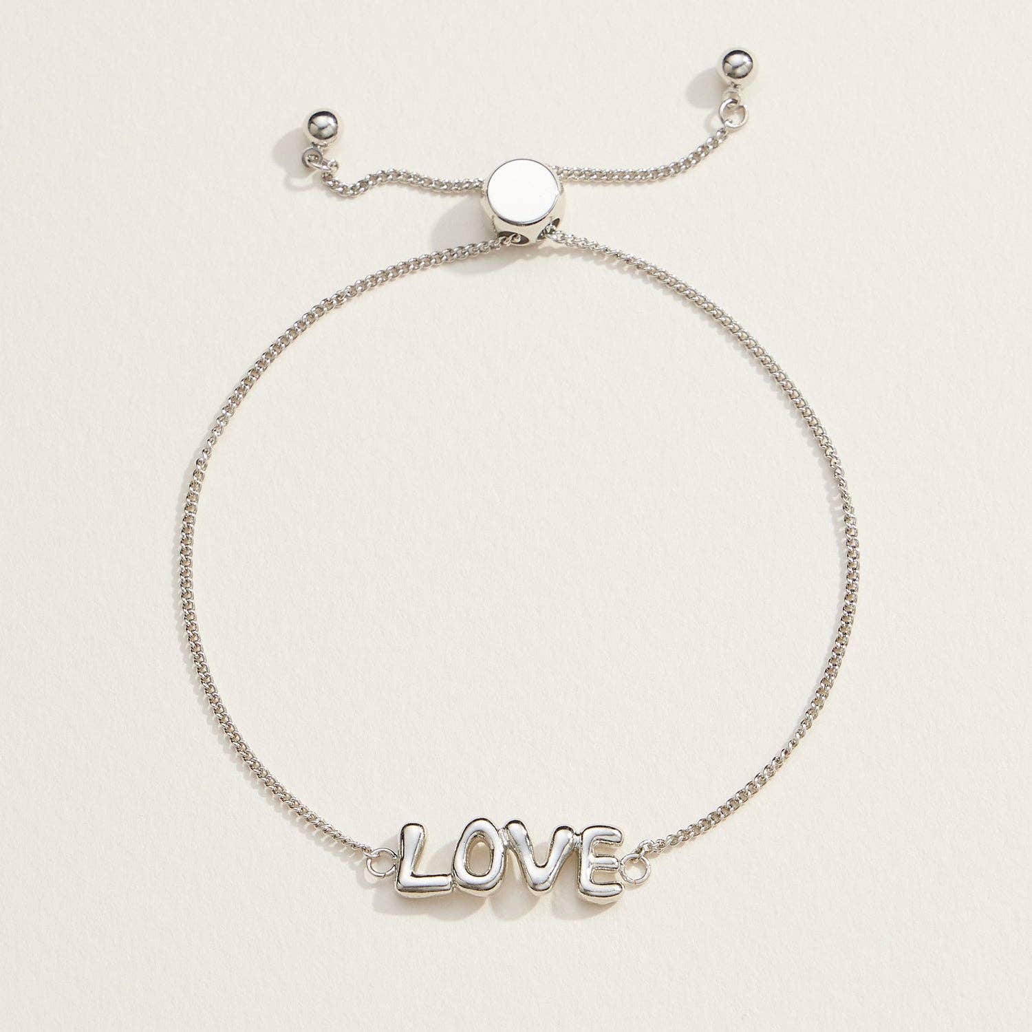 Spread love with our Love Script Adjustable Bracelet, featuring a sleek "LOVE" design in polished silver tones. This lightweight and chic bracelet has an adjustable chain with a sliding clasp, ensuring a perfect fit for any wrist size. Whether worn solo or layered, this bracelet is a versatile accessory for daily wear or special occasions. It's an ideal gift for anniversaries, Valentine's Day, or simply to show someone you care.
Details:
Love Script
Adjustable
18K Gold Dipped Bracelet in Silver
