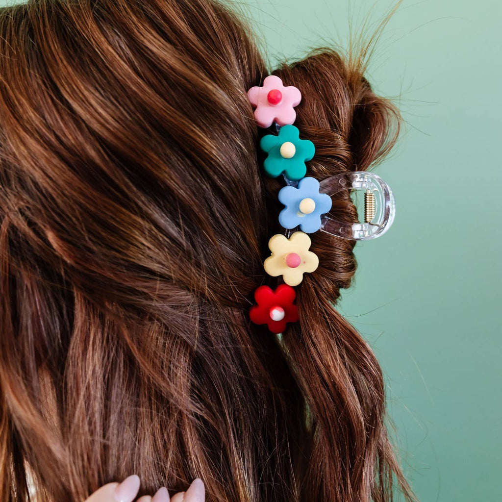 Need the perfect claw clip for spring!?! This blossom claw clip is the most perfect clip for you!!! It comes in 3 colors - pink, blue, and rainbow!! I love the cute little flowers and how it looks when worn in the hair. I think you'll need every color! Go before they're gone!