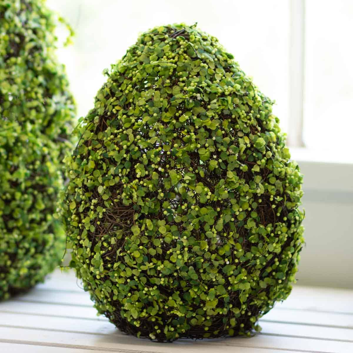 This Belmont 8"x11" Egg Moss Decor Green is the perfect addition to your home decor. The beautiful green color and unique design will add a touch of nature to any room. Its lightweight and durable construction makes it easy to display anywhere, providing a sense of calm and tranquility. Elevate your home's ambiance with this lovely decorative piece.