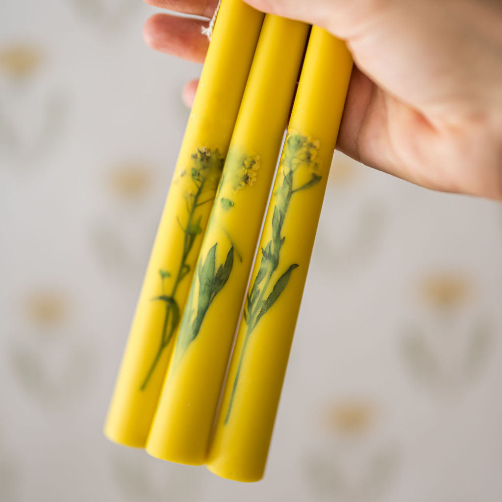 upclose shot of the florals inlaid in the taper candles