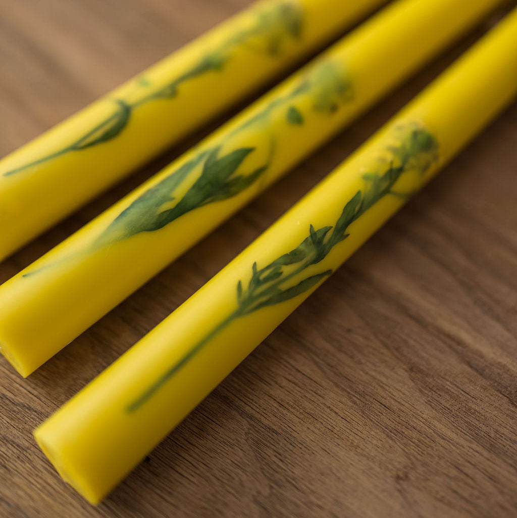 upclose shot of the florals inlaid in the taper candles