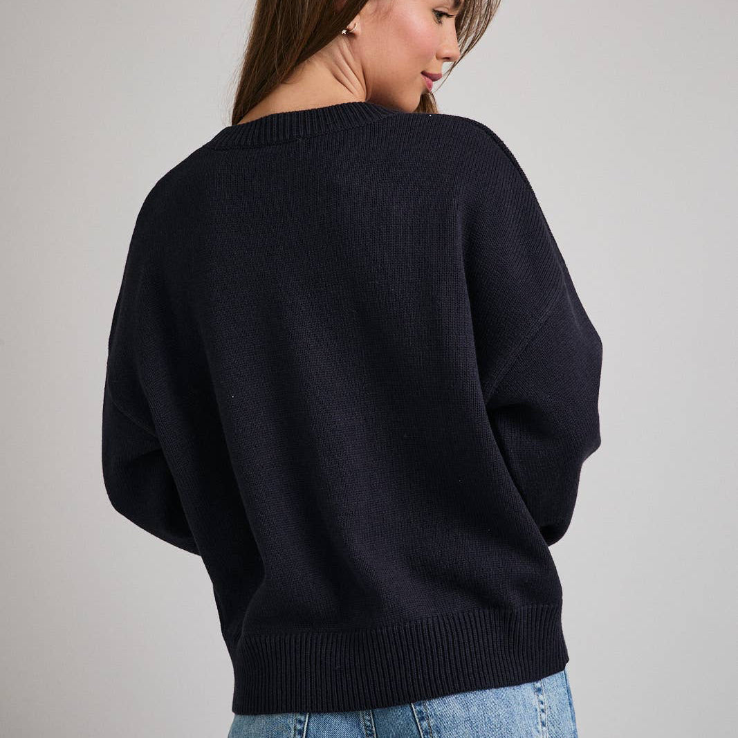 This cozy black crewneck sweater features a classic knit texture with a single, festive Christmas tree design on the front. Perfect for sharing holiday cheer, its comfortable fit keeps you warm while celebrating the season. Ideal for holiday gatherings or casual winter wear, it combines festive spirit with everyday comfort.
Details:
Model is wearing a size small; model height: 5'8", bust: 32B, waist: 24", hips: 34"