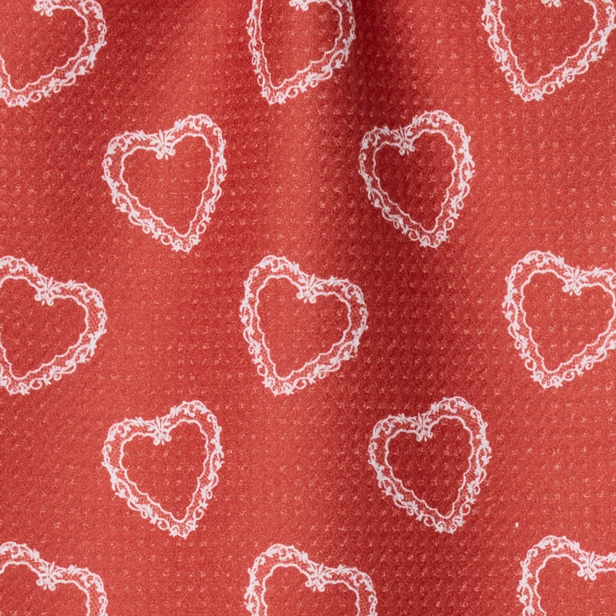 Red fabric with white heart patterns Tea Towel