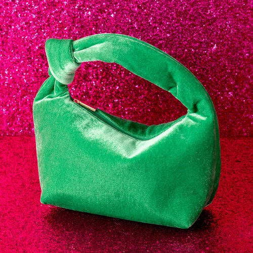 Introducing the Dana Mini Bag from Shiraleah, a perfect accessory for the fall/winter season. Crafted from durable polyester, this top handle bag embodies the trend-driven lifestyle that the brand stands for. It's a versatile piece that adds a touch of elegance to any outfit, making it a thoughtful gift for yourself or a friend. Enjoy the special feeling that comes with carrying a Shiraleah bag.