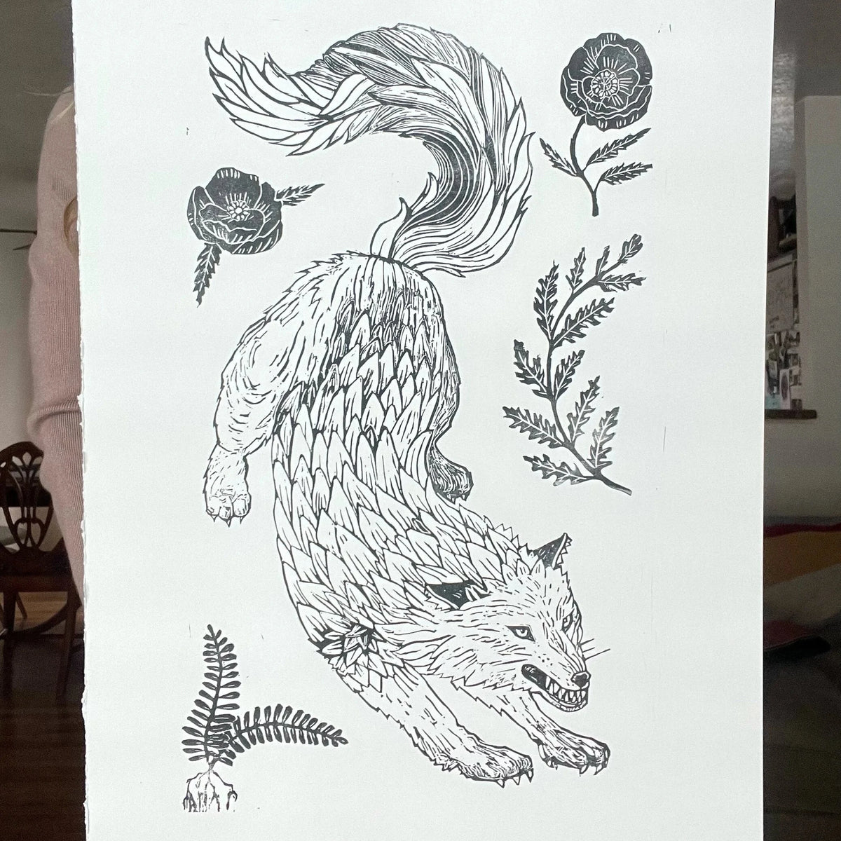 Wolf print held by woman.