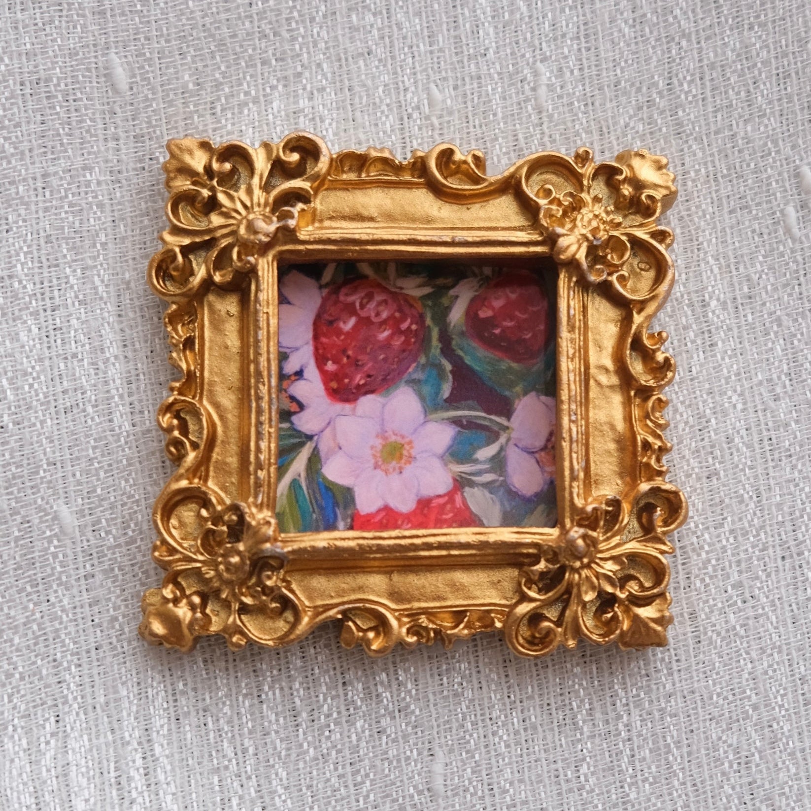 Mini framed art magnet with a strawberry painting. A cute, cozy accent for your fridge or any magnetic surface.