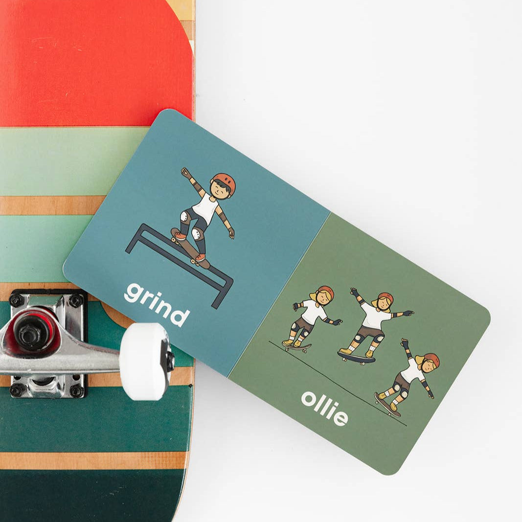 Skateboard with cards showing skateboarding illustrations and terms on a white background