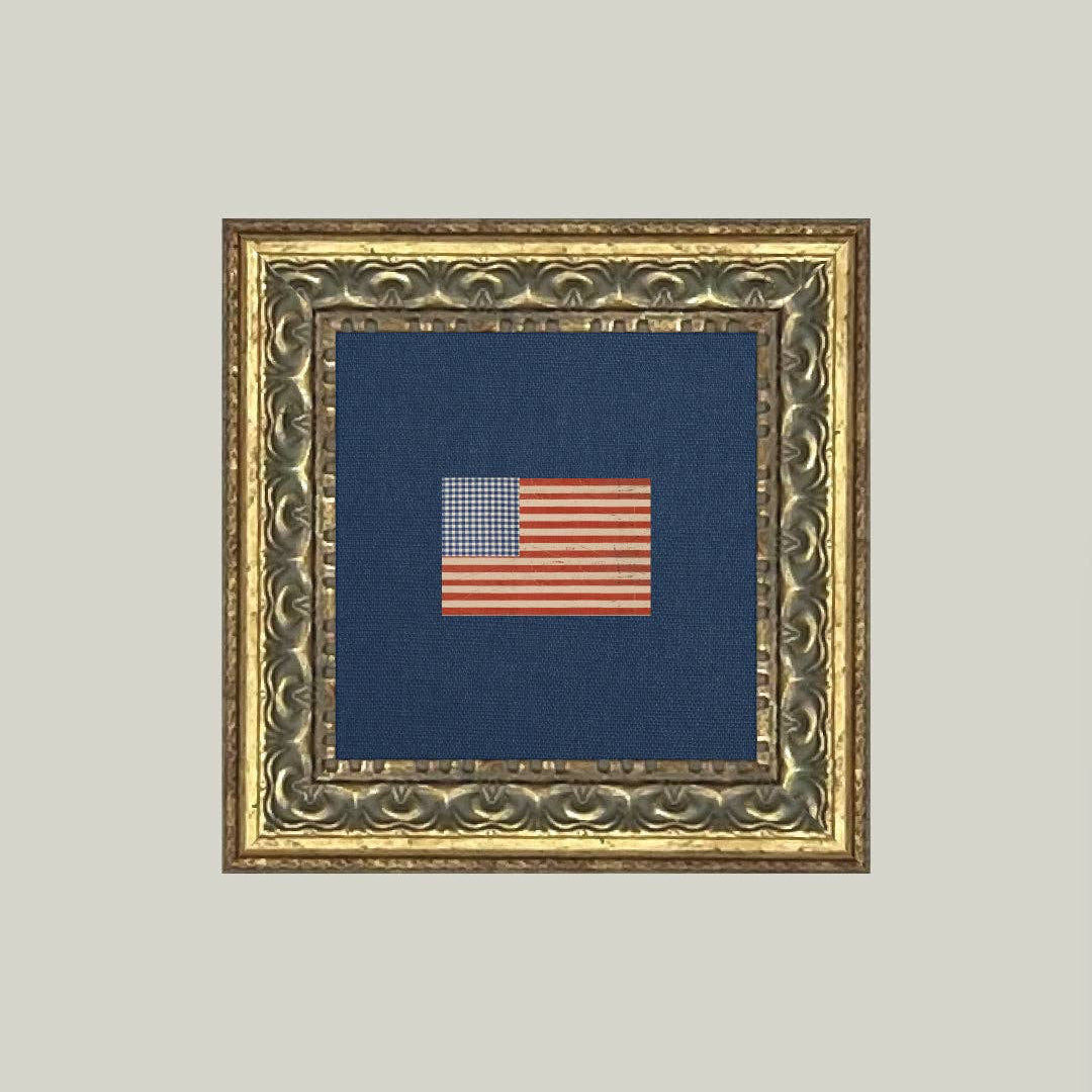 Bring timeless elegance to your space with this Gingham Flag Framed Antique Art. Printed on premium canvas fabric, this piece features a handcrafted ornate frame that adds classic charm to any room. The glass-free design keeps the artwork lightweight while preserving the authentic texture of the canvas. Perfect for those who appreciate vintage-inspired décor, this framed art comes ready to hang with included hardware and paper backing. Made in the USA with quality craftsmanship, it's a statement piece that
