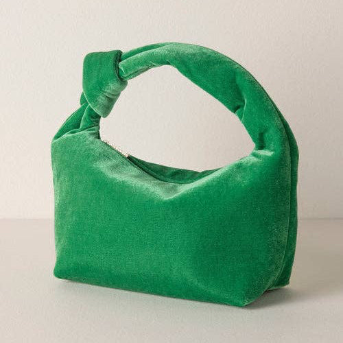 Introducing the Dana Mini Bag from Shiraleah, a perfect accessory for the fall/winter season. Crafted from durable polyester, this top handle bag embodies the trend-driven lifestyle that the brand stands for. It's a versatile piece that adds a touch of elegance to any outfit, making it a thoughtful gift for yourself or a friend. Enjoy the special feeling that comes with carrying a Shiraleah bag.