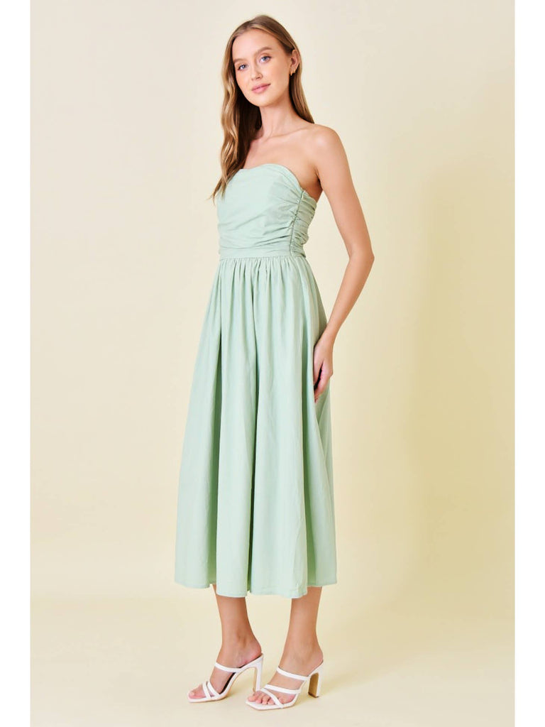 Look effortlessly chic in our Strapless Midi Dress in Sage! This stylish dress features a strapless design that is perfect for warmer weather and a flattering midi length. Its sage color adds a touch of sophistication, while the strapless design allows for comfortable and versatile wear. A must-have for any fashion-forward individual!