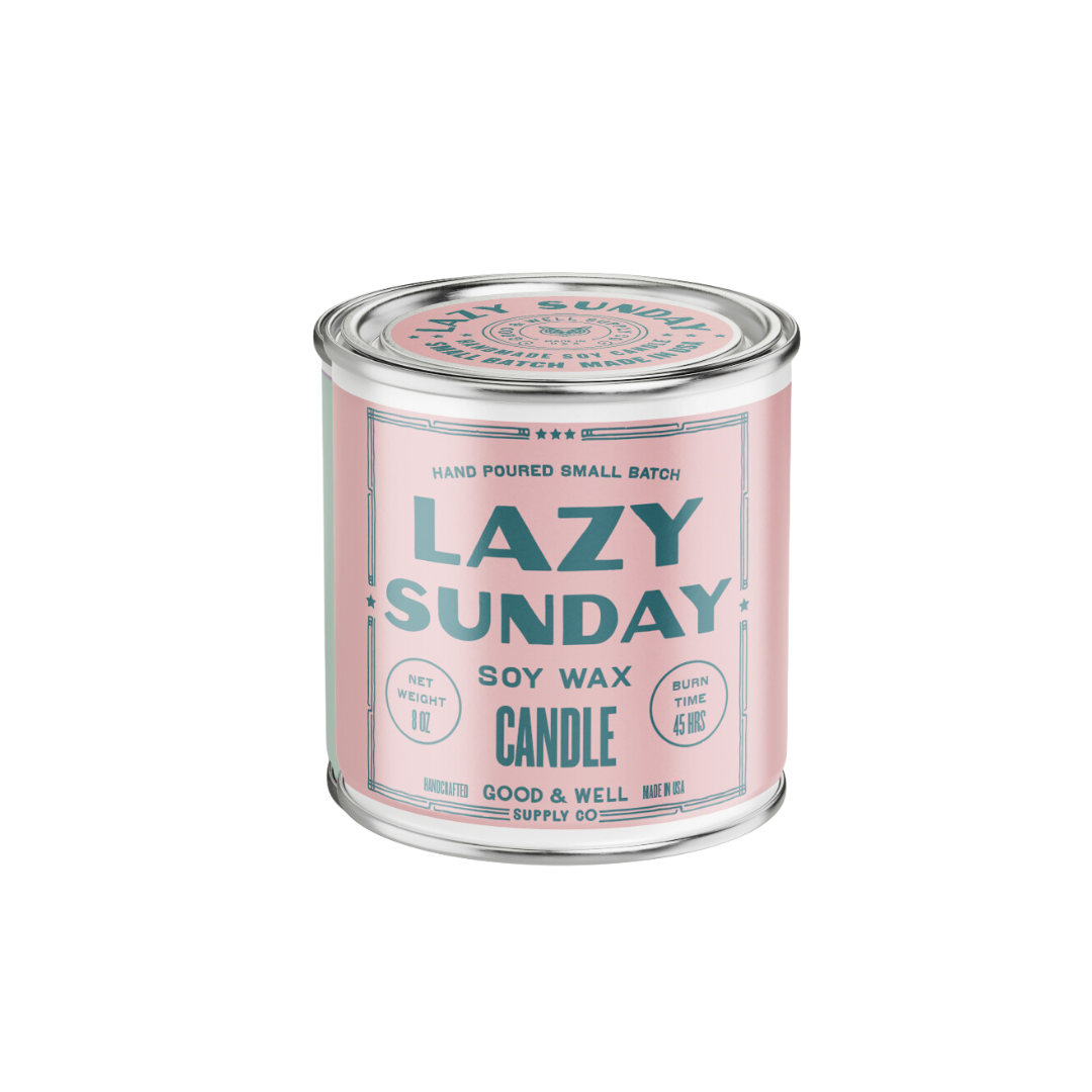 Candle jar labeled 'Lazy Sunday' with a pink label on a white background