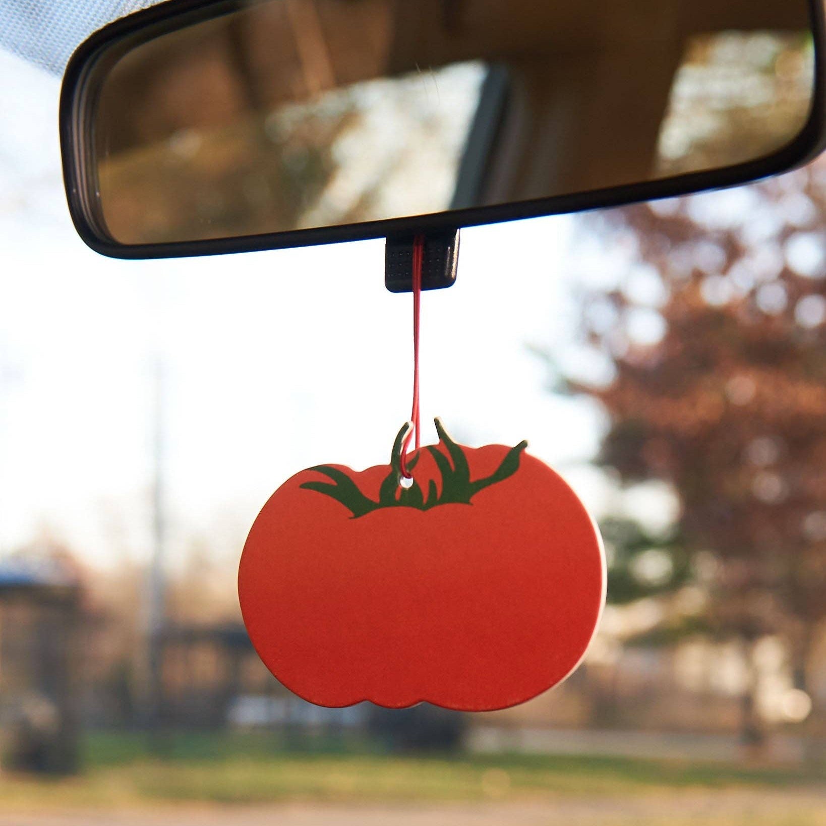 Create your own "tomato girl summer" with this heirloom tomato hanging air freshener. Cinnamon candy scented, similar to a Red Hot candy or cinnamon bear. Printed on a thick and durable paper and scented with high quality essential oils, our air fresheners are great for a quick refresh of your car, office, or home. Plus, they’re a cute ornament to keep around after the scent has faded.
Details:
Measures 3"
Double sided
Designed and packaged in Columbus, OH; made in China
Artwork by Meghan Hopkins