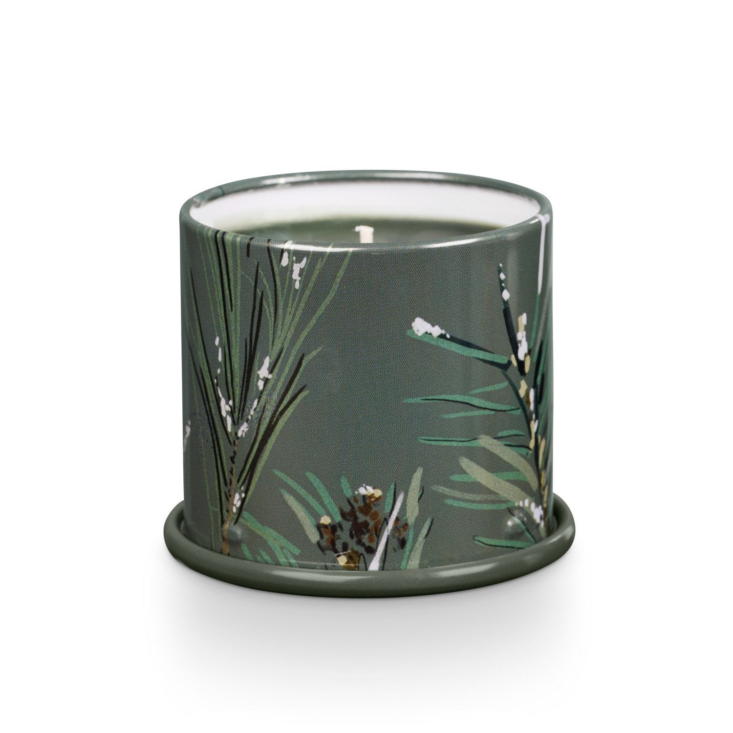 Candle in a green container with floral design on a white background