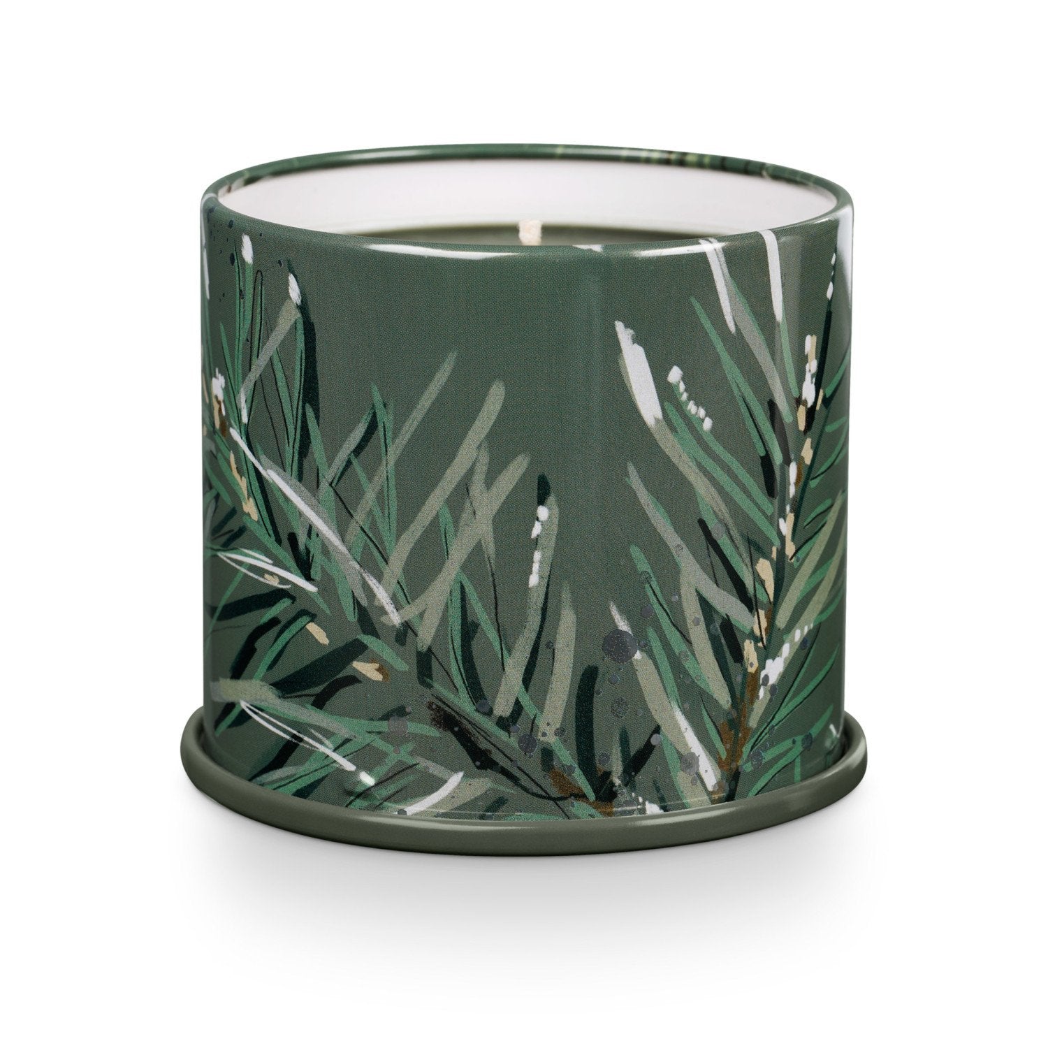 Green candle with leaf pattern on a white background