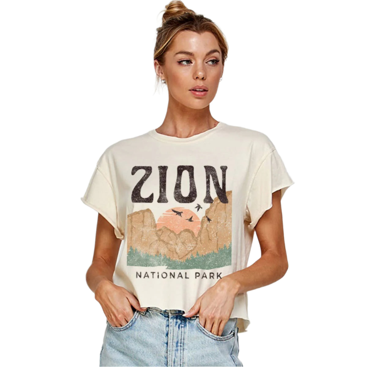 Woman wearing a t-shirt with 'Zion National Park' design on a plain background