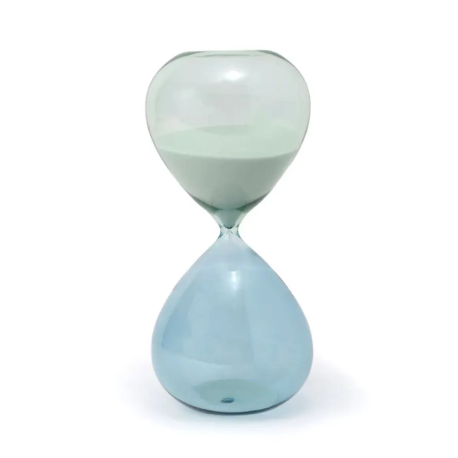 Find the time to work through a tough task or to take a moment for yourself with our elegant hourglasses. Add this beautiful glass accessory to your desk or counter as a mindful way to keep track of the passing moments. Seaglass Ombre.
