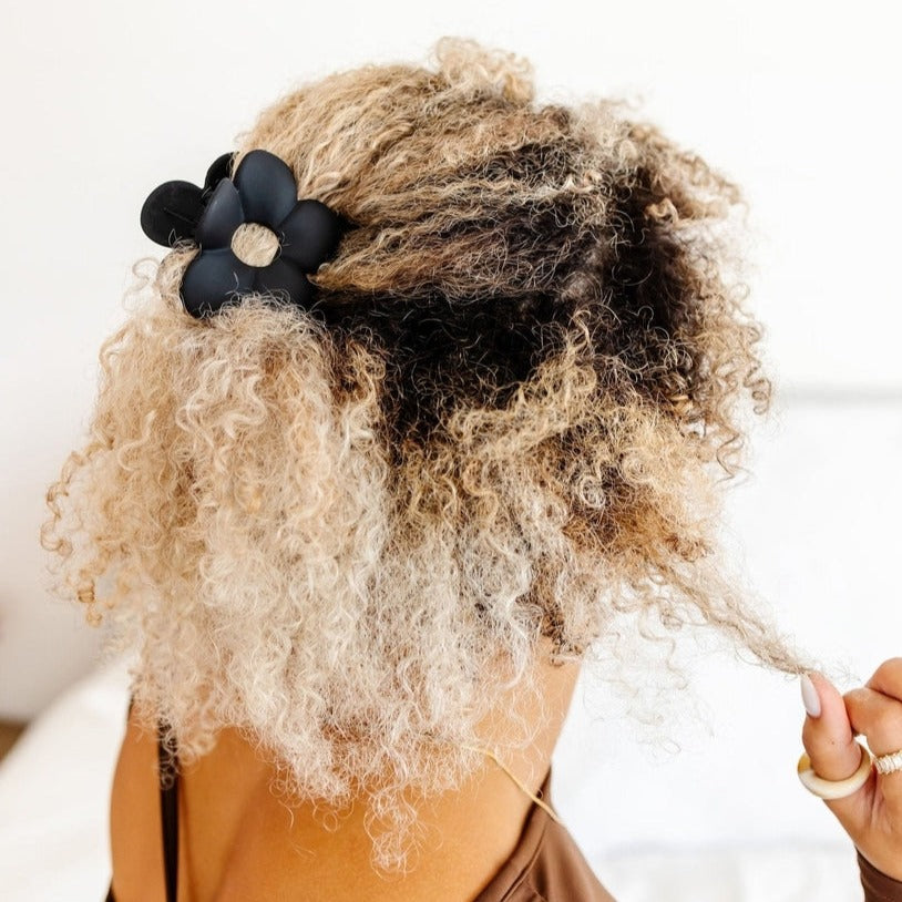 This flower claw clip is perfect for all hair types, but especially thick hair! It's super deep and has curved claws that keep your hair secure and up all day. It adds the cutest dainty touch to any hairstyle or outfit, and it's definitely a must. It is a medium size claw clip that measures about 2.5 inches.