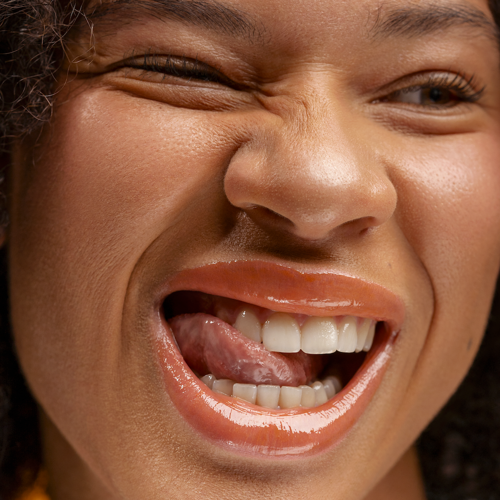 Close-up of a woman's face with a joyful expression