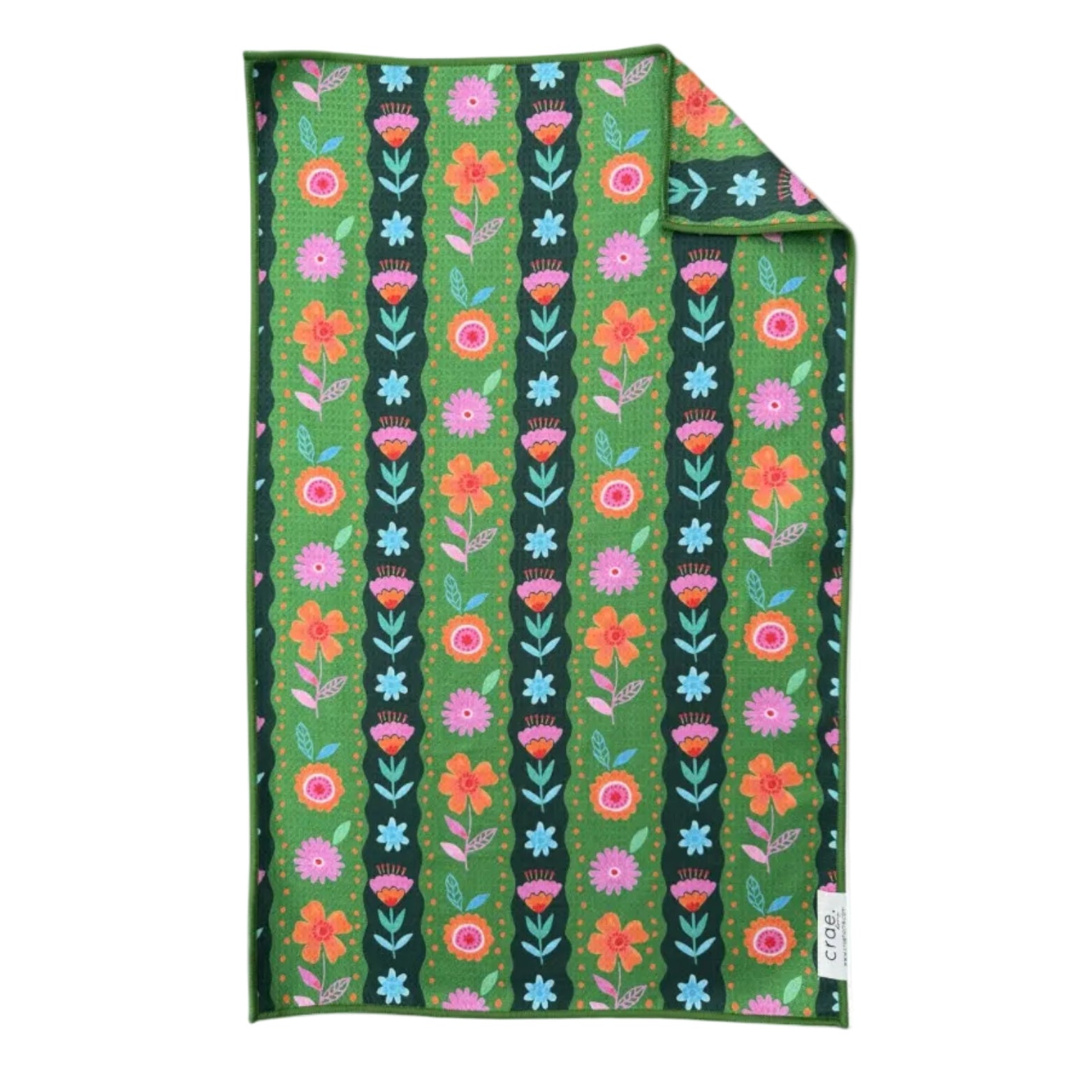 Floral patterned towel with colorful flowers on a green background