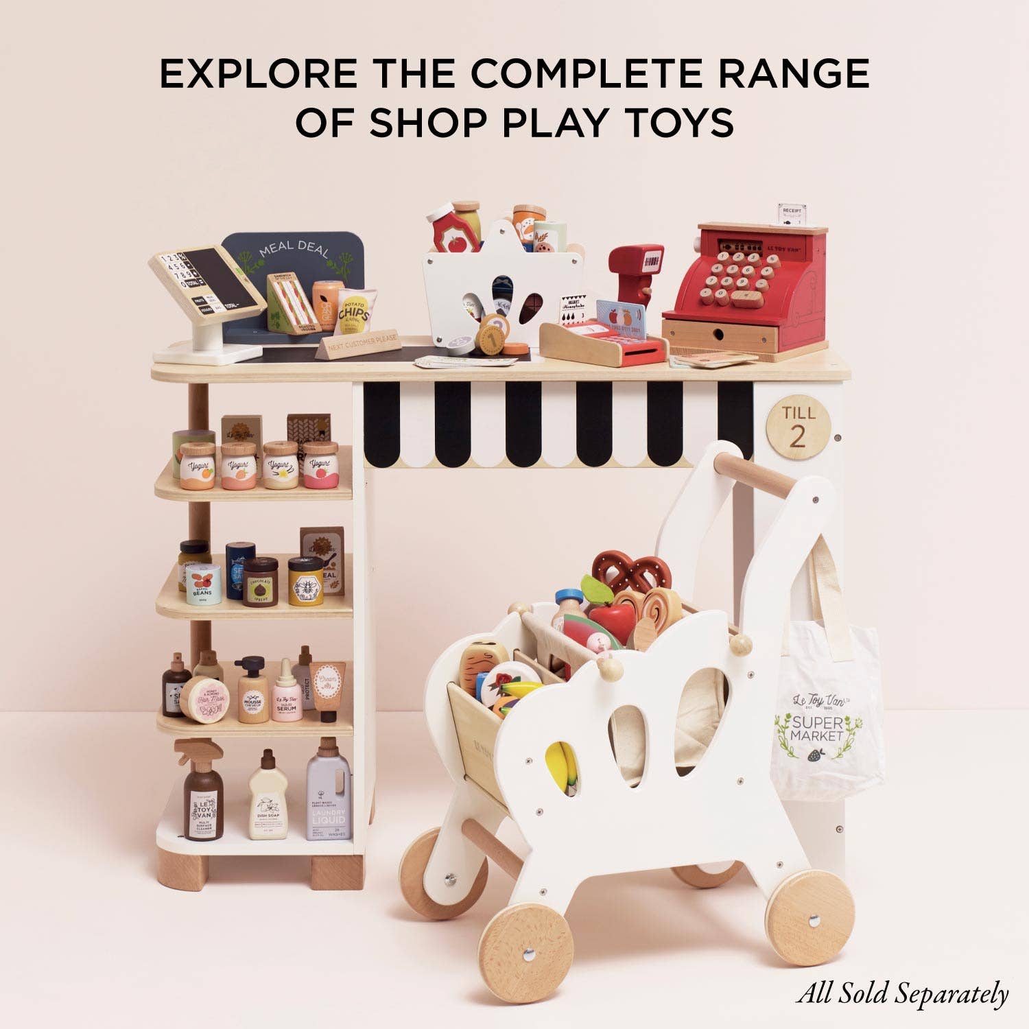 Toy store setup with a toy cash register, shelves, and a toy cart on a light pink background.