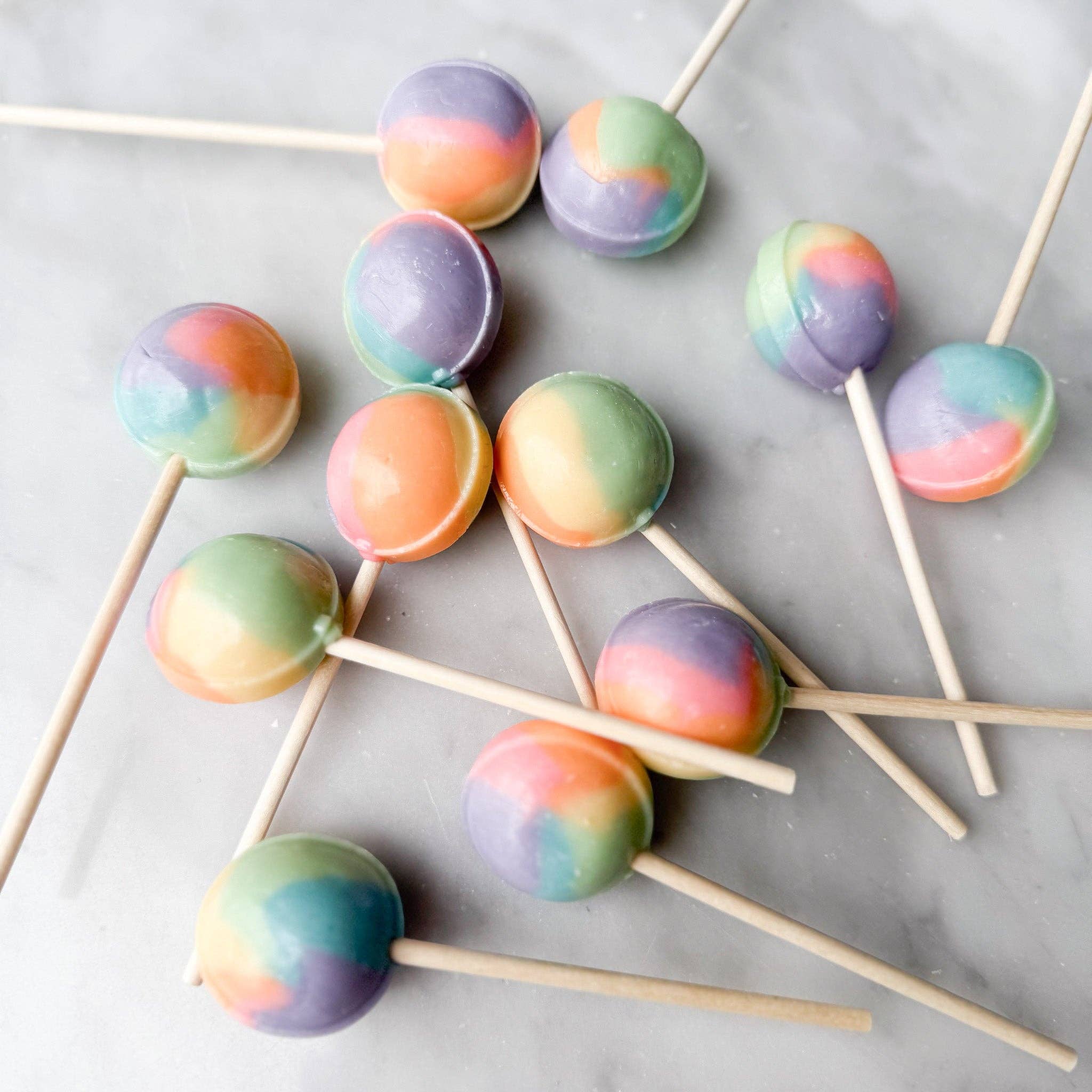 Our Rainbow Sherbet lollipop is a beautifully pastel-colored treat that captures the essence of all your favorite fresh fruity flavors. This lollipop offers a refreshing blend of deliciousness, making it a delightful choice for anyone seeking a sweet and fruity experience.
Details:
Made in the USA, our candy is all American candy— made in small batches by our talented candy makers
Ingredients: sugar, glucose, water less than 2% of citric acid, food coloring, artificial/natural flavoring, vegetable glyceri