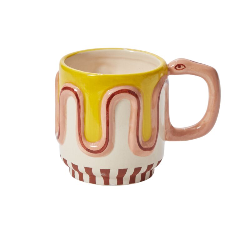 Wildly cute yet perfectly tame, the ceramic Wild Tails Snake Mug adds a little flavor to beverages with its playful design. Featuring a dimensional squiggle snake that wraps around as the handle, this food-safe mug makes a delightful addition to tableware with warm colors, hand painted details, & organic pattern.