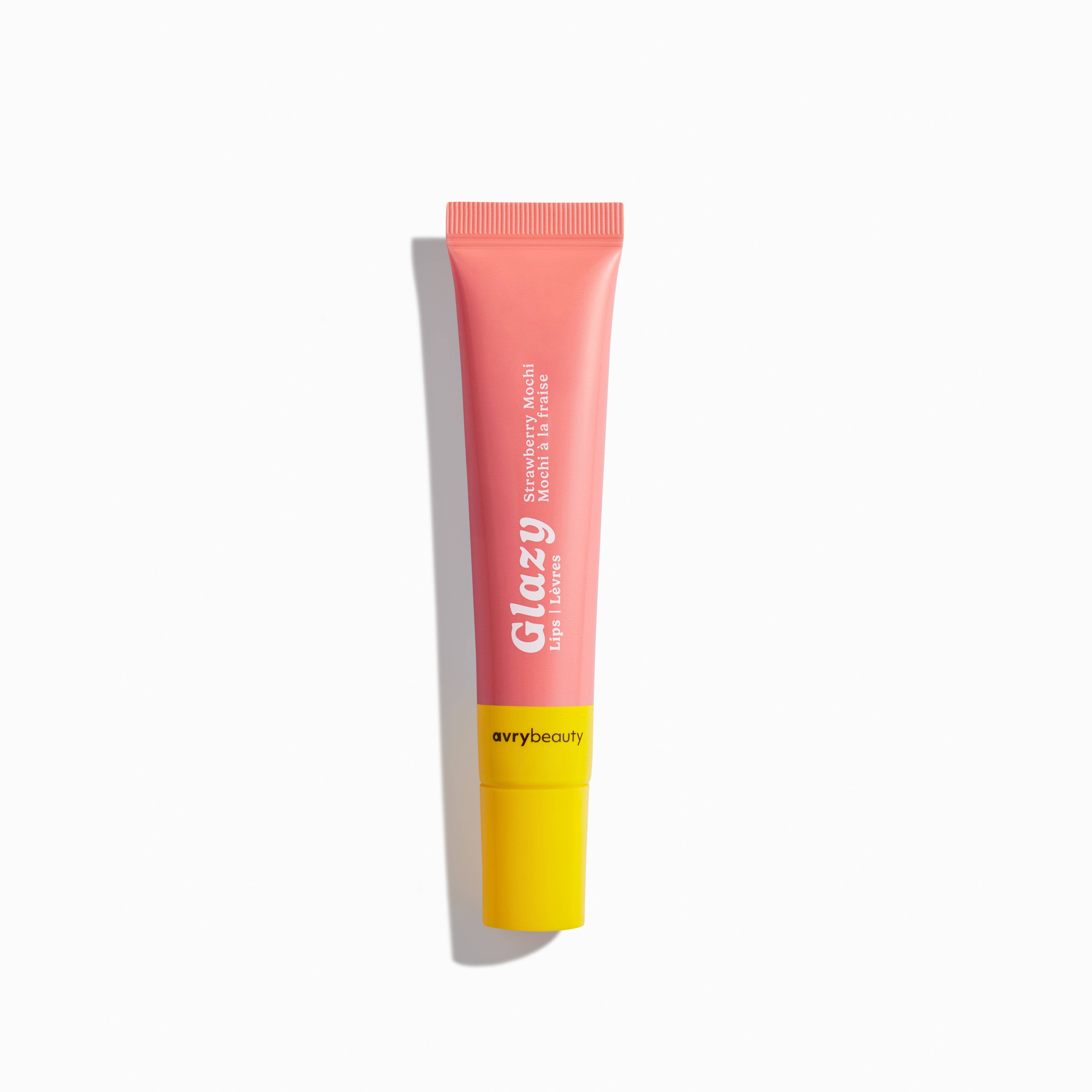 Tube of Glazy lip balm with pink top and yellow bottom on a white background