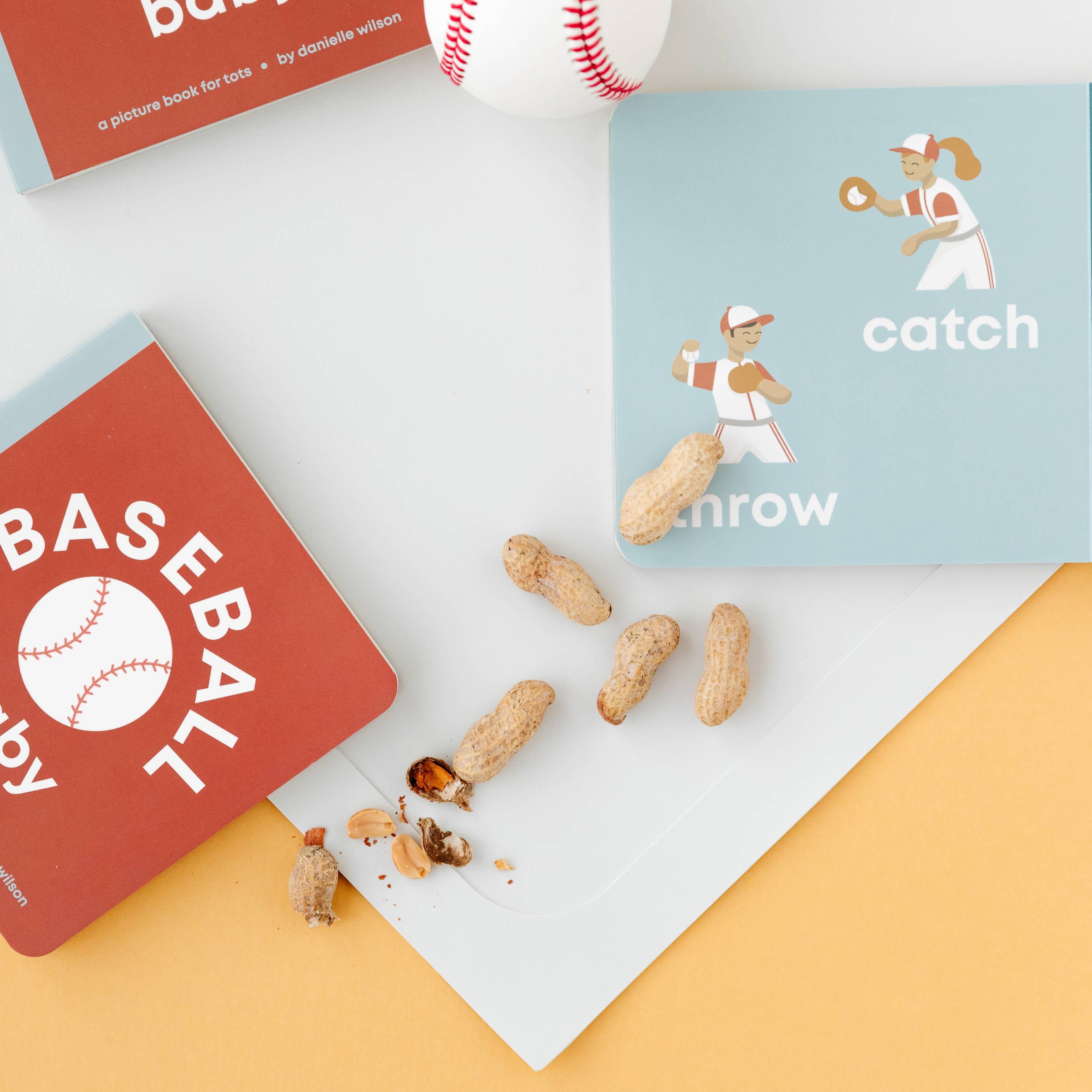 Baseball-themed baby shower game cards on a colorful background