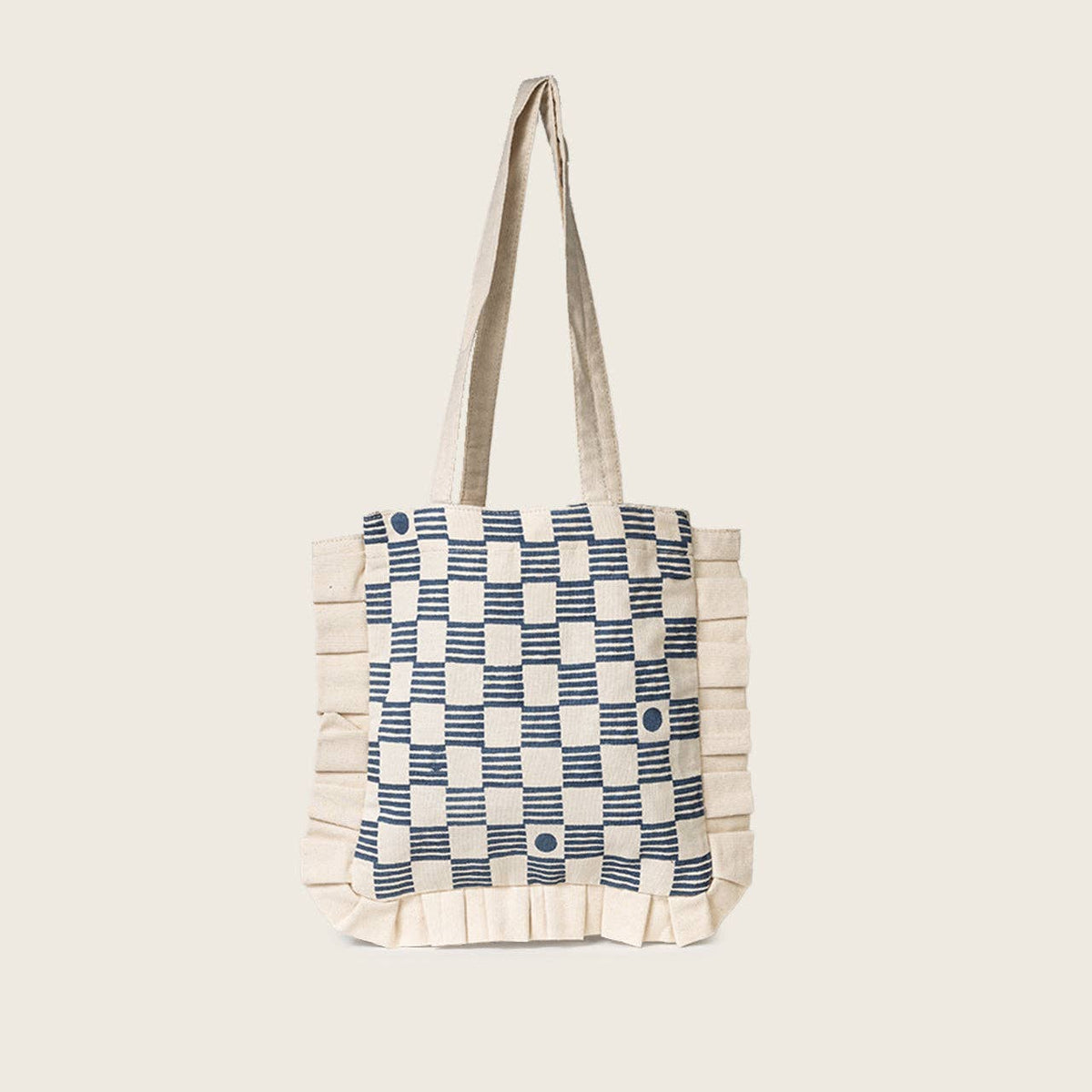 Tote bag with blue and white checkered pattern on a beige background