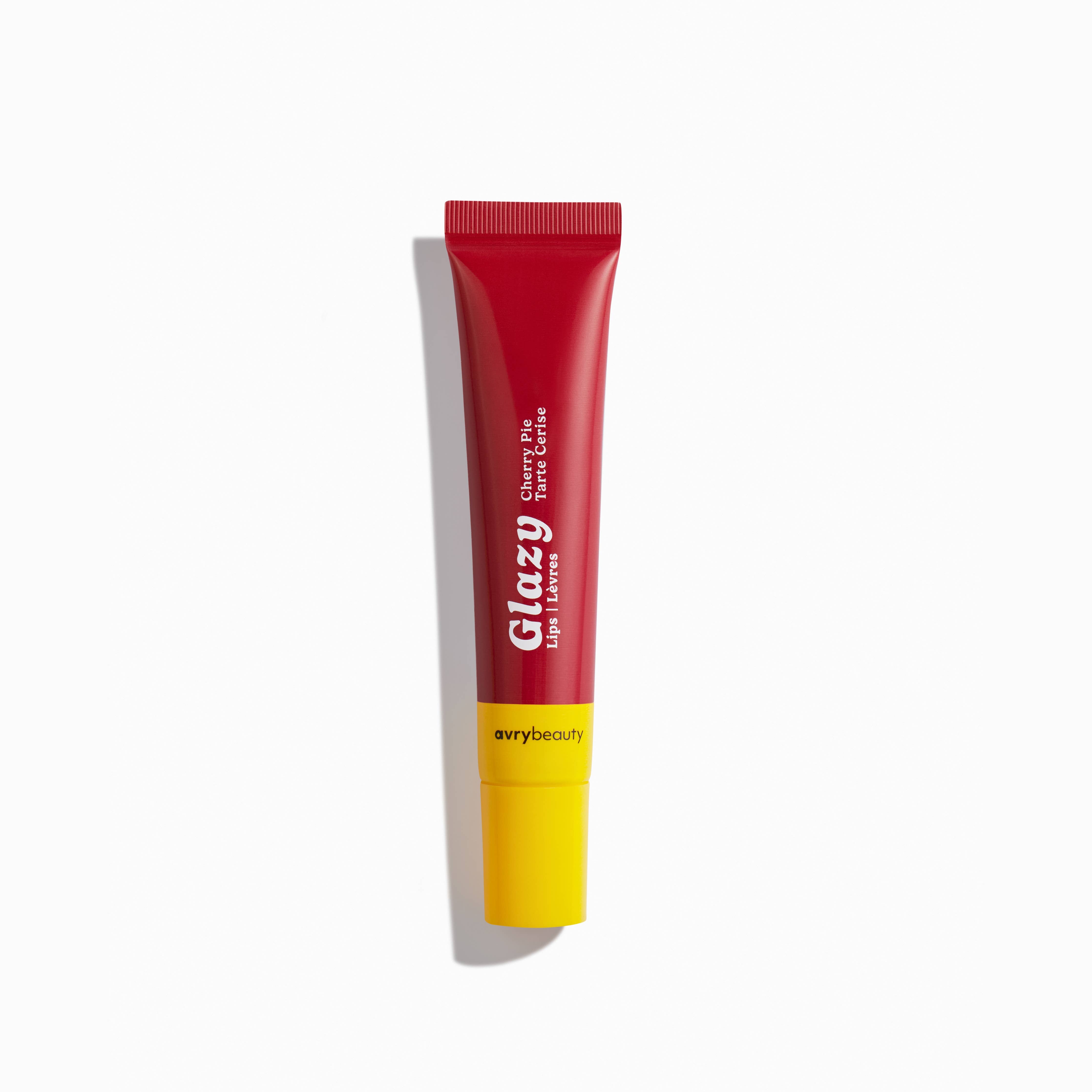 Red and yellow lip balm tube with 'avrybeauty' branding on a white background