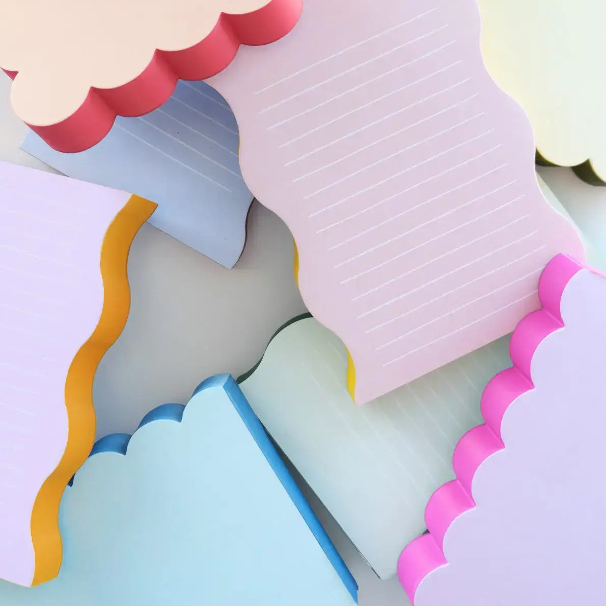 Colorful paper cutout shapes on a light gray background