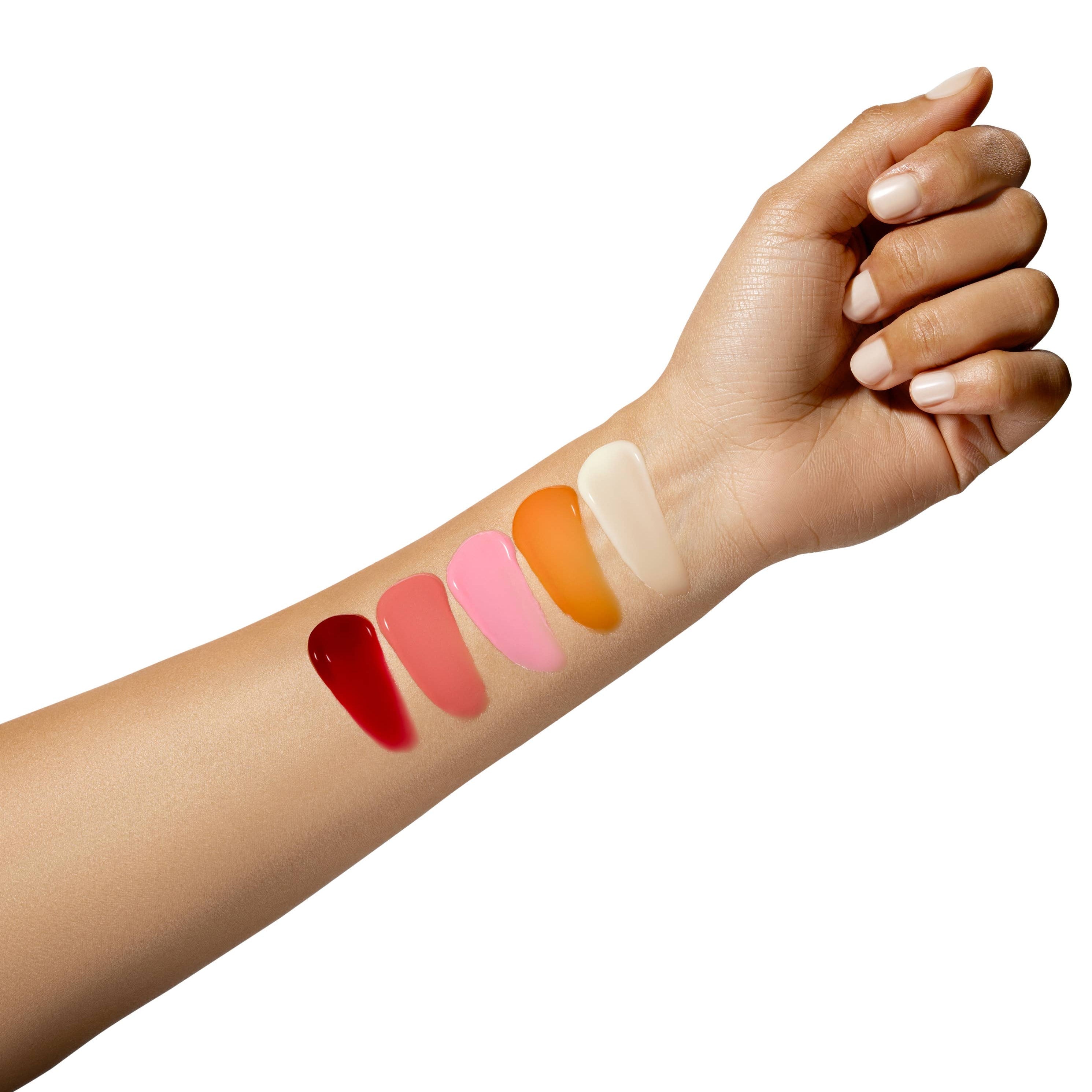 Hand with swatches of lipsticks on a white background