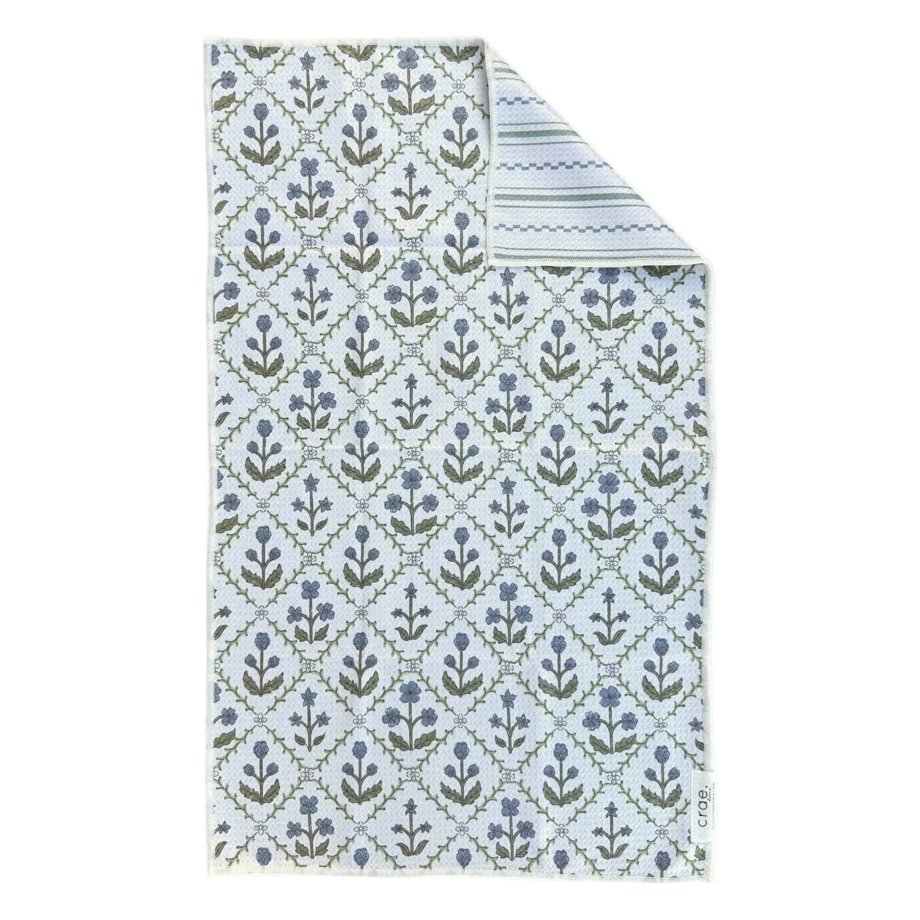 Floral patterned tea towel with blue and green design on a white background