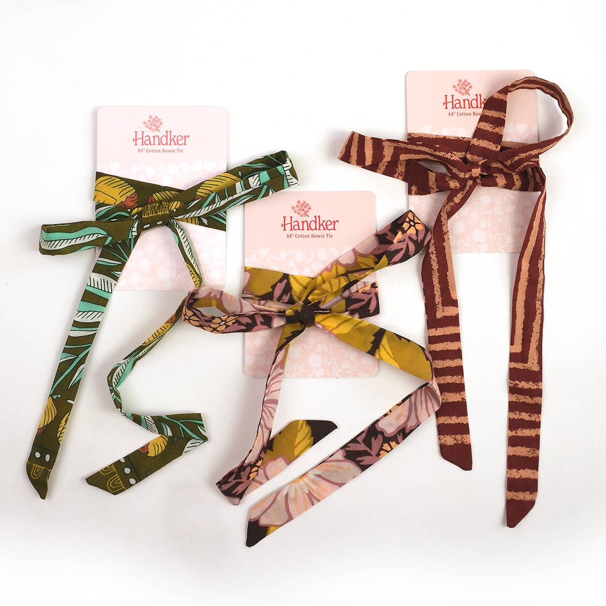 Three patterned hair ties on pink cards with 'Handker' branding against a white background.