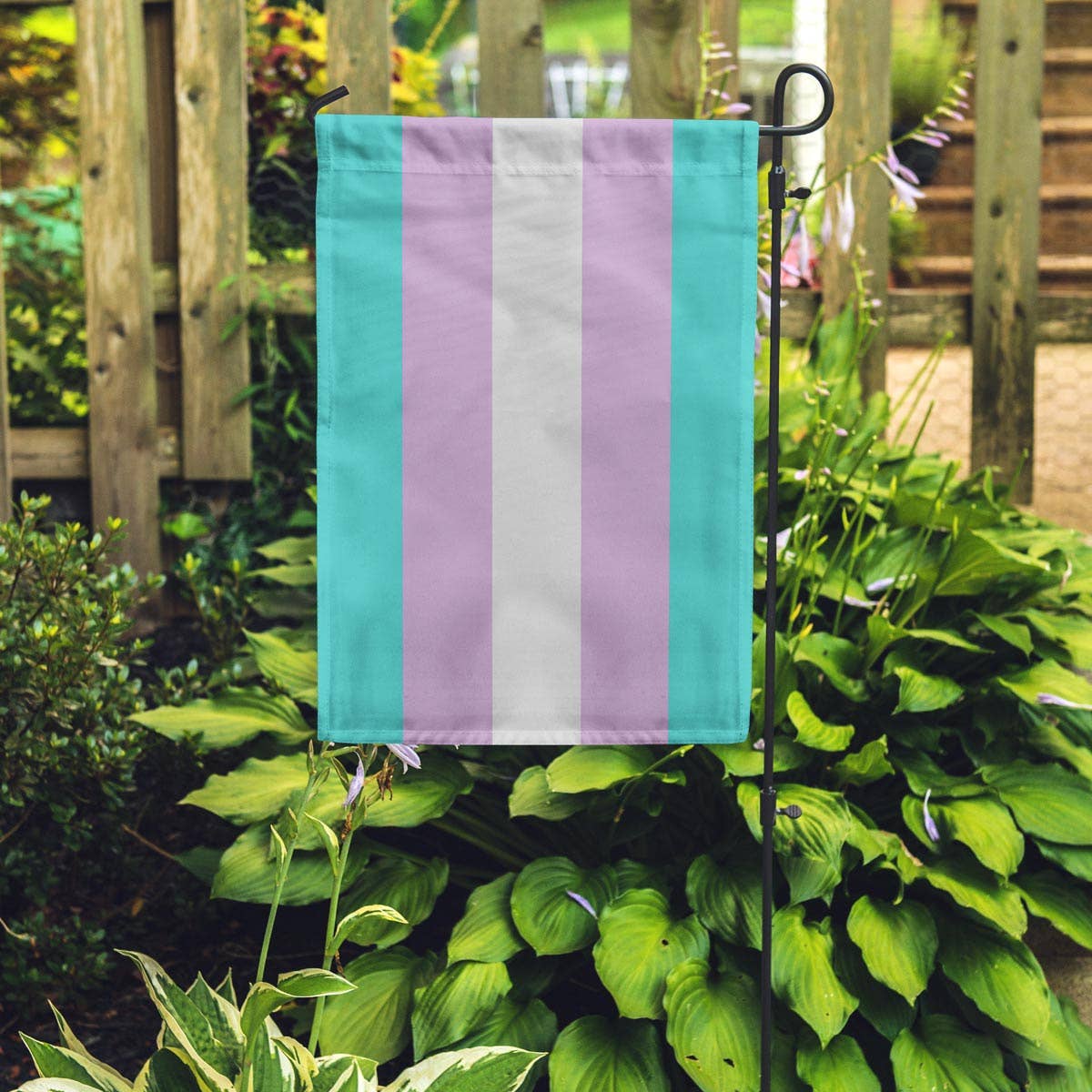 Transgender garden flag. The Transgender Pride Flag was created by American Trans woman Monica Helms in 1999, and was first shown at a pride parade in Phoenix in the year 2000. Now in this cute vertical size, perfect for your garden flag pole (not included.)18" x 12"