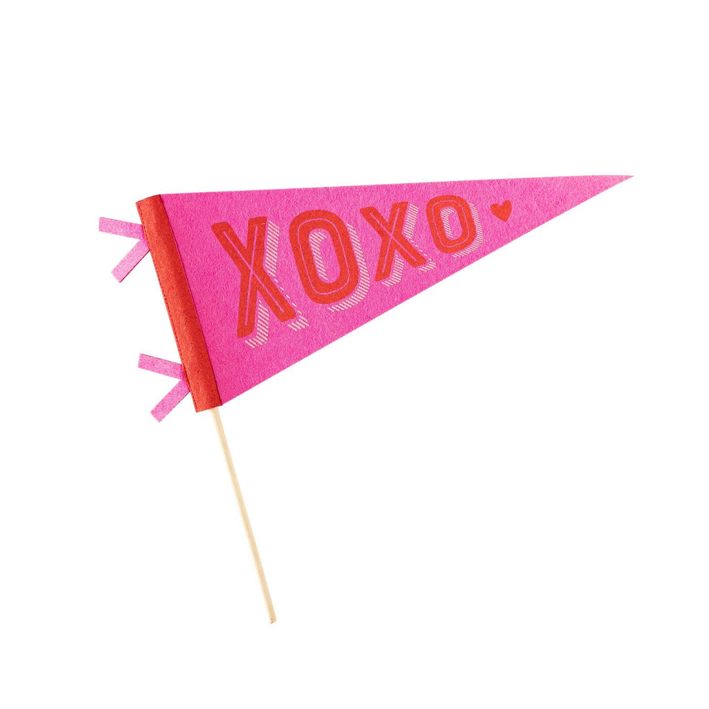Our XOXO Felt Pennant is the perfect way to show your love! This bright and playful statement piece features bold red and pink felt, with a fun XOXO design that adds a touch of whimsy to any room. Let your love show through with this charming pennant!