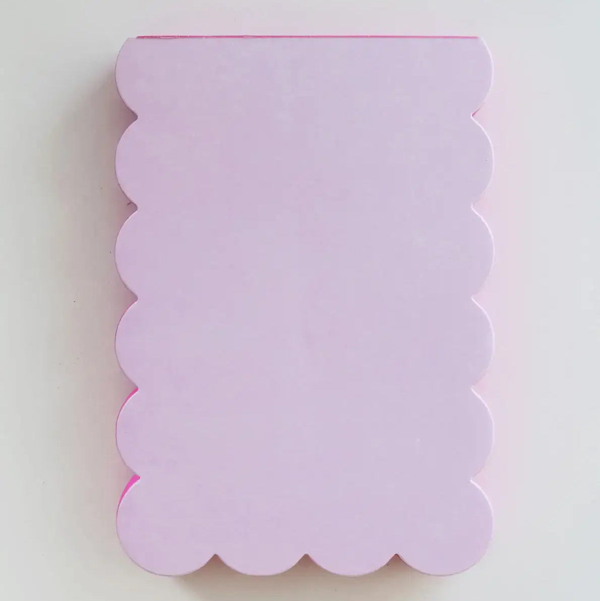 Scalloped-edged lavender card on a white background