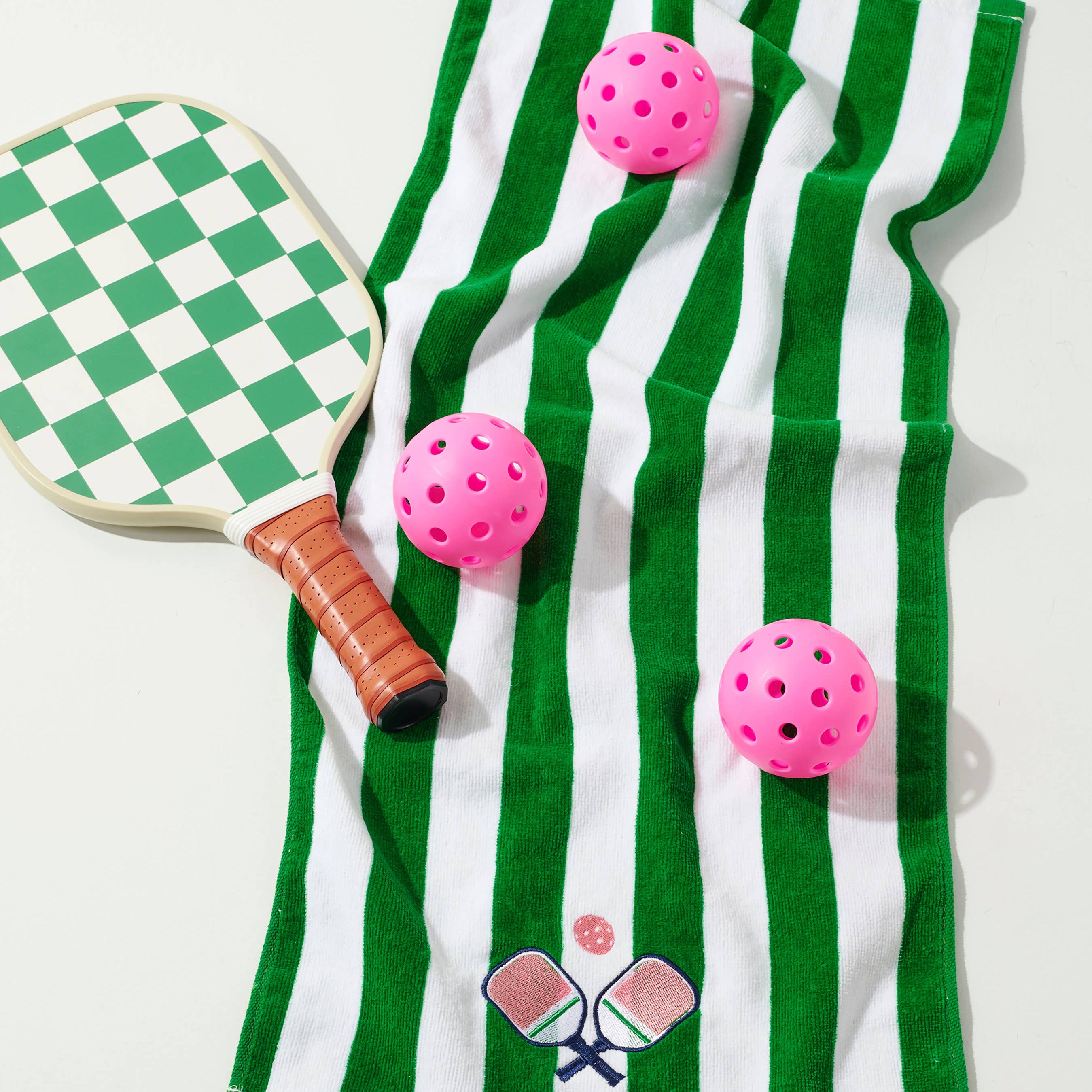 Stay fresh and stylish on and off the court with The Paddles Stripe Pickleball Towels! Featuring Bold Green-and-White, these towels are as functional as they are fun. Embroidered with playful paddle and ball details, they're the perfect courtside companion for your pickleball matches or practice sessions.