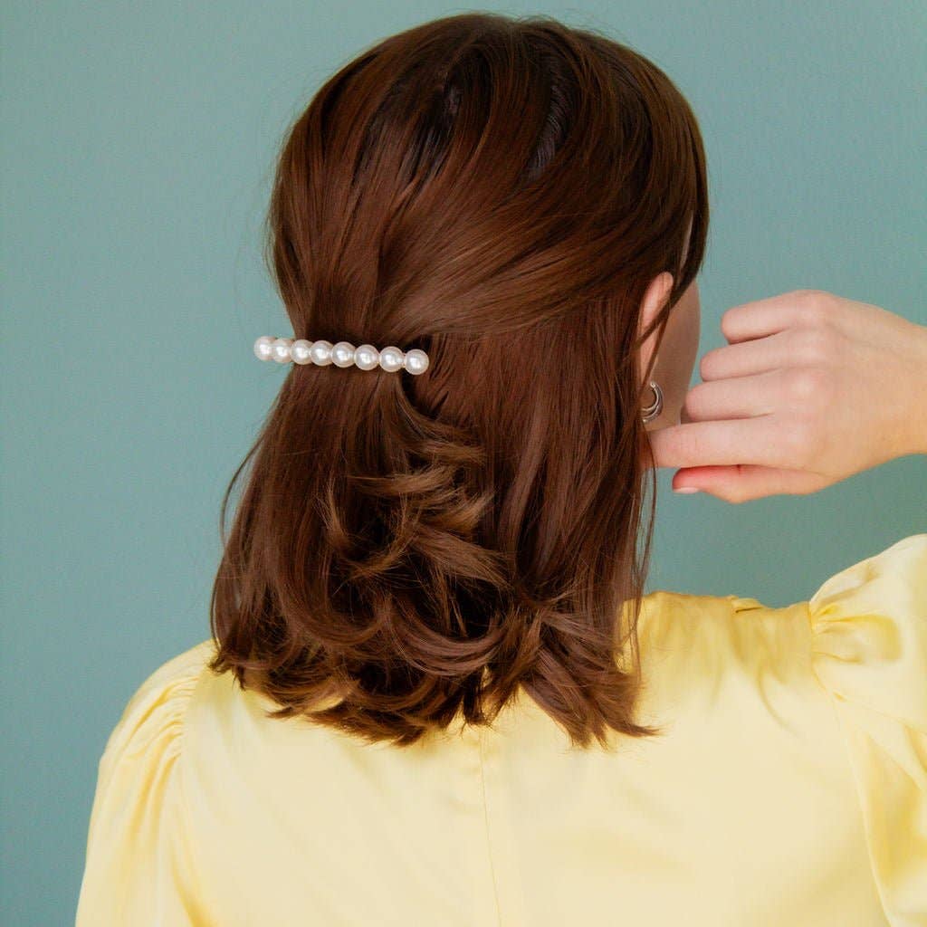 Barrettes are by far the easiest, cutest, and simplest way to style your hair. Andi’s Barrettes are curated specifically to hold your hair securely, and breathtakingly. This barrette is a gorgeous line of 8 medium-sized pearls on a French barrette. It will be your go-to accessory and always have your hair looking its best. 