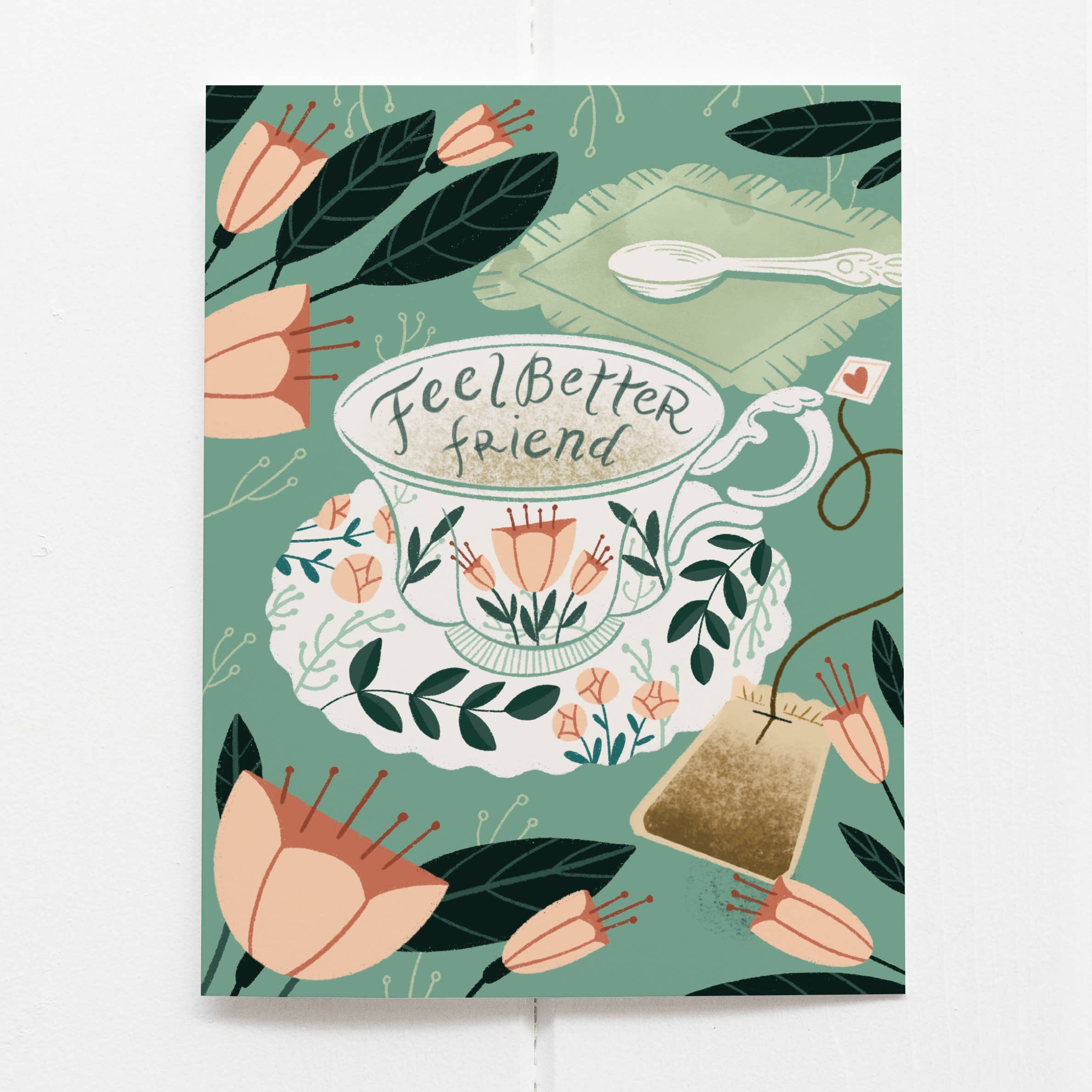 Illustration of a teacup with 'Feel Better Friend' text, surrounded by flowers and leaves on a green background.