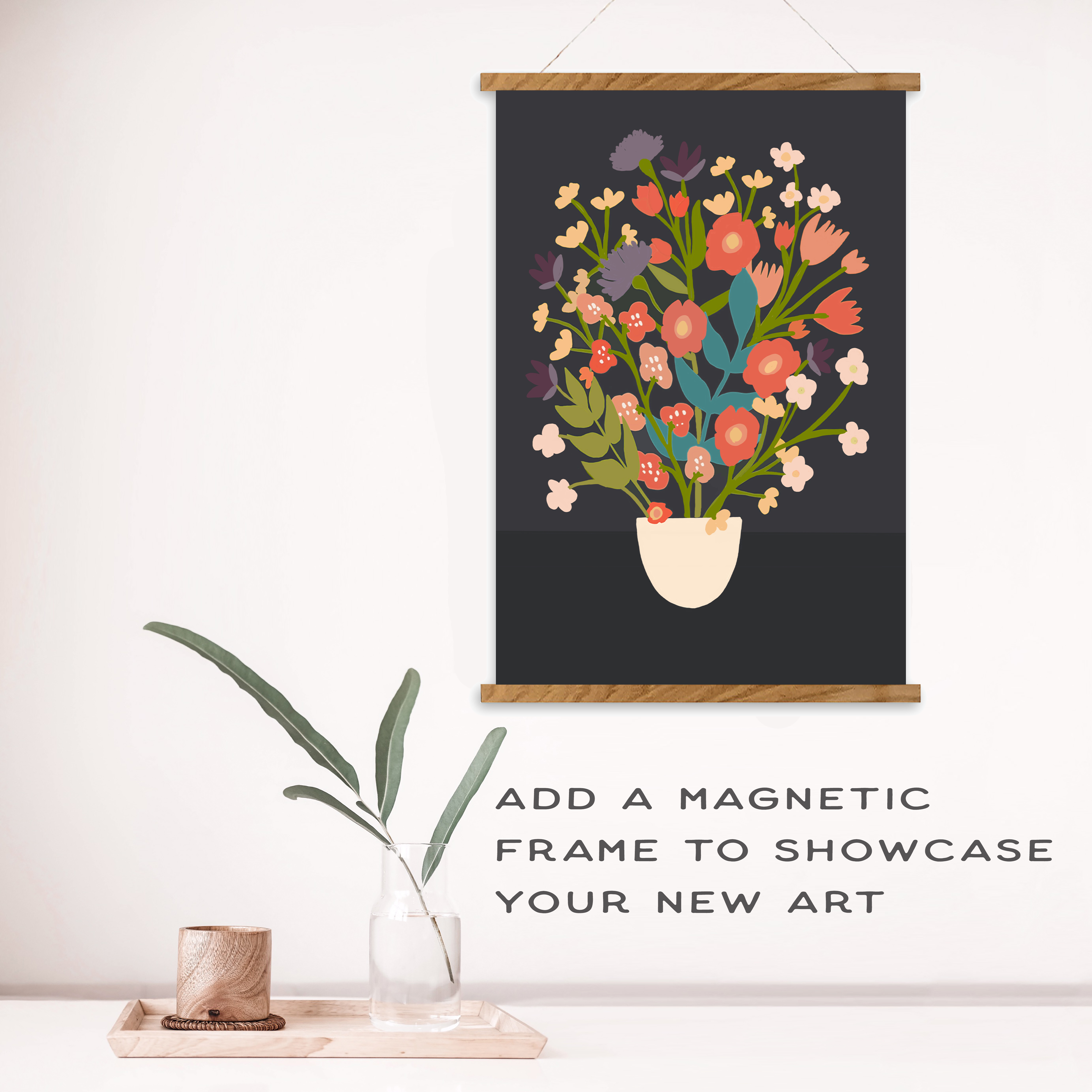 Floral art print in a wooden frame on a wall with decorative elements below.