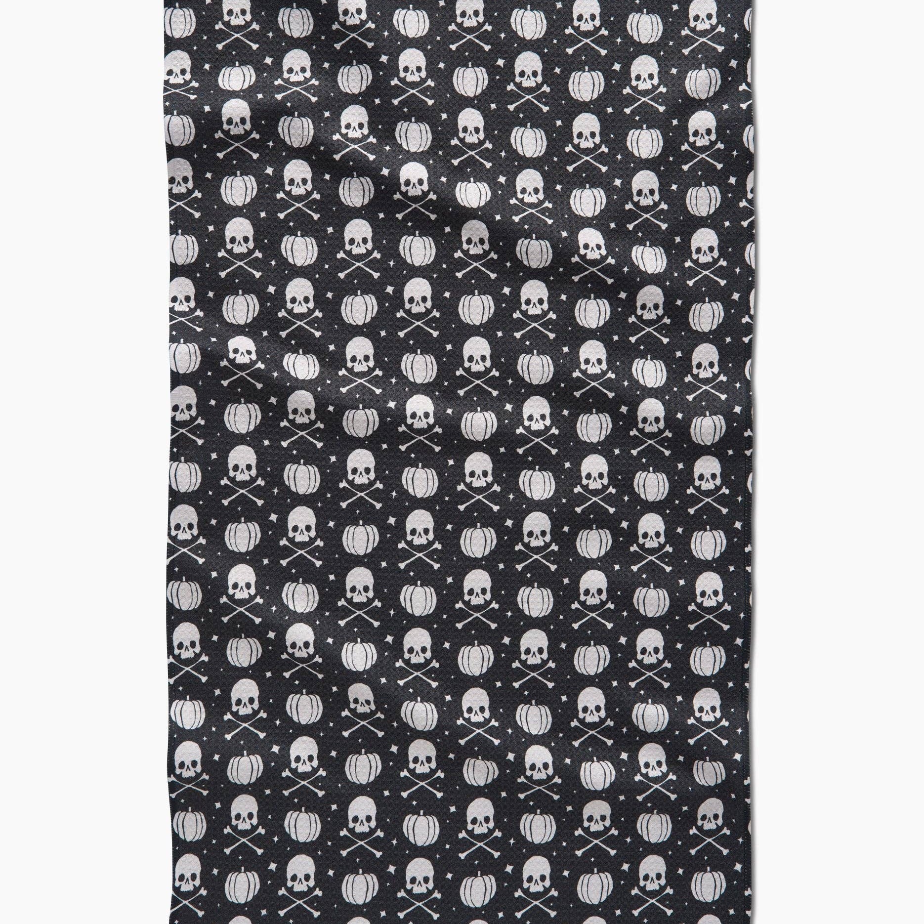 Pattern of pumpkins and skulls on a black background