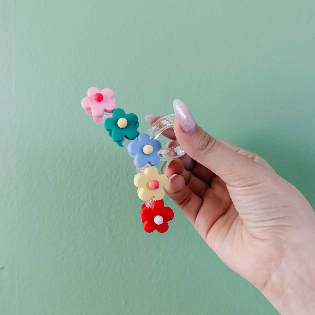 Need the perfect claw clip for spring!?! This blossom claw clip is the most perfect clip for you!!! It comes in 3 colors - pink, blue, and rainbow!! I love the cute little flowers and how it looks when worn in the hair. I think you'll need every color! Go before they're gone!