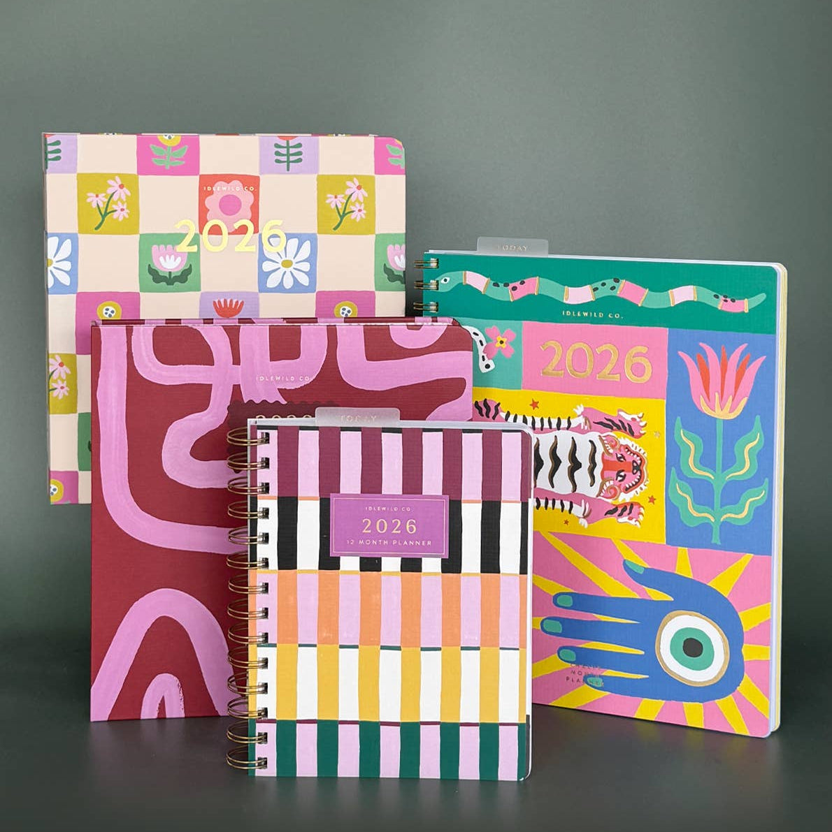 Set of colorful planners and journals on a dark background