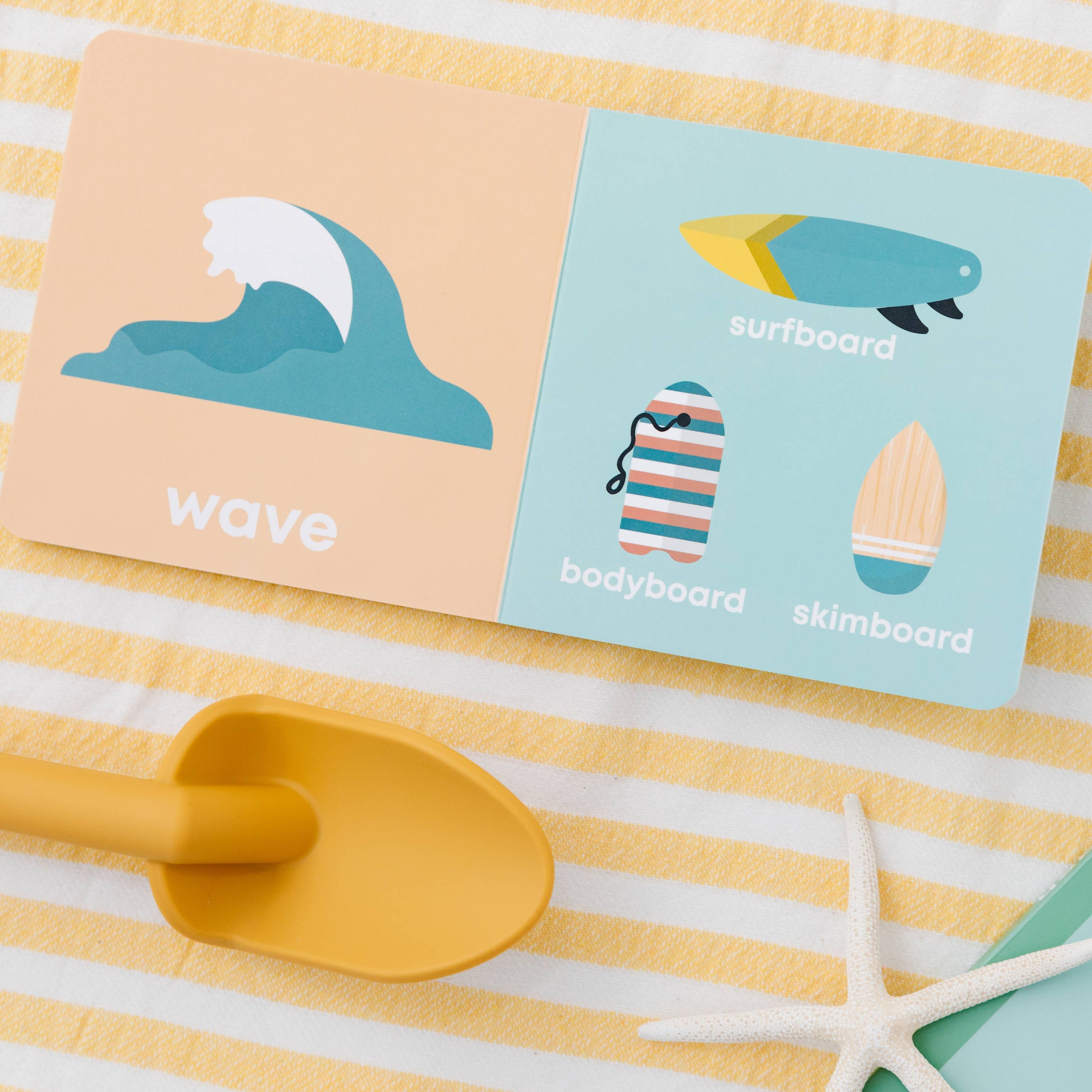 Two cards with beach-themed designs on a striped yellow and white surface with sunglasses and a sandal.