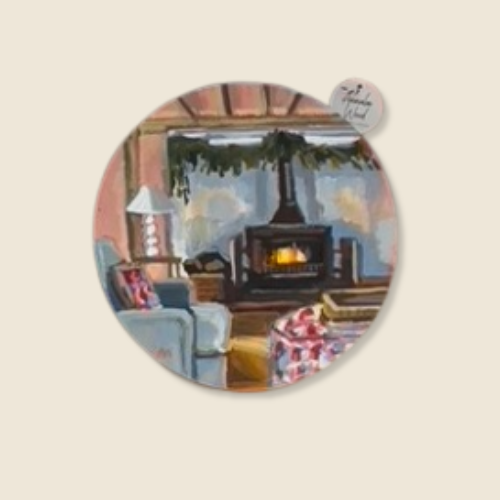 8” round oil on panel, cozy interior scene: wood burning stove, Blue walls, wooden ceilings, pine garland hung above the stove, blue sofa with floral ottoman, white lamp, gold carpet