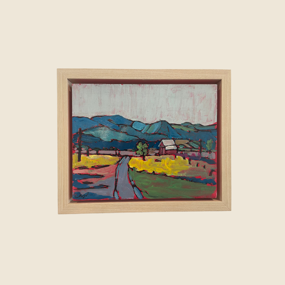 Landscape mixed media painting, with blue hills, yellow green foreground, with house in the distance and road leading to the mountains. The sky is a light grey blue.