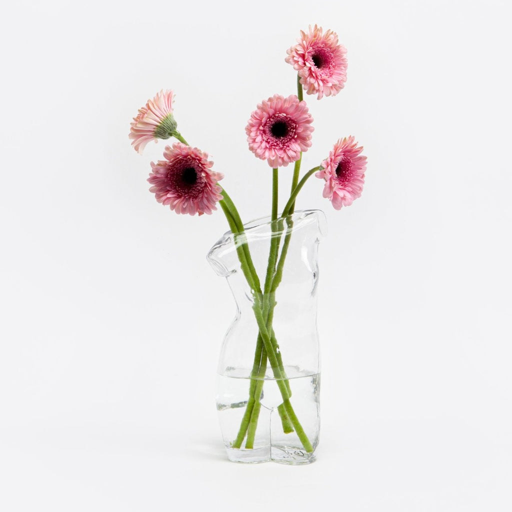 "Add some whimsy to your home decor with this transparent vase! Perfect for displaying your favorite flowers or as a standalone piece, its glass body adds a touch of elegance and modernity. See-through never looked so good. (Flowers not included)"