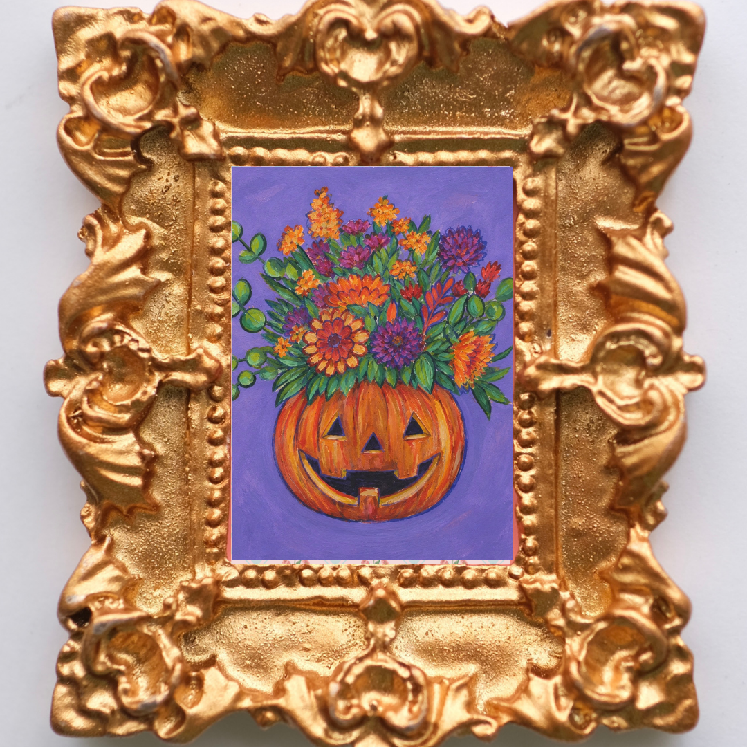 Cheery jackolantern smiles with a bouquet of flowers. Inside a tiny magnetic gold frame.