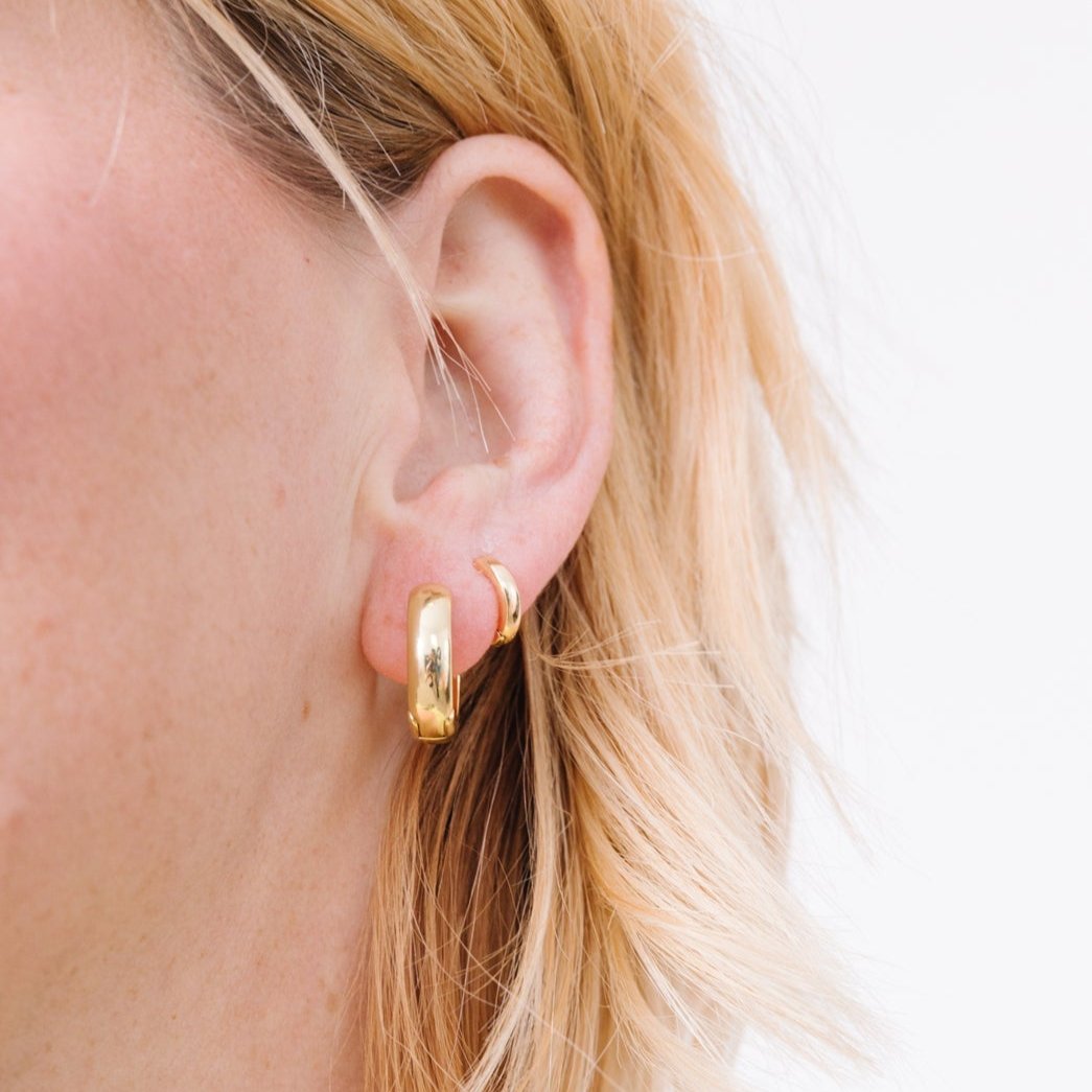 14k gold filled. Safe for sensitive skin. Unique clasp has no post when earrings are closed, allowing for comfortable wear and sleep without having to remove earrings. Available in 9 mm and 16 mm, Hypoallergenic, While gold filled is a strong, sturdy metal for maximum lifespan we don't recommend subjecting the earrings to lots of chemicals, waters, perfumes, etc.